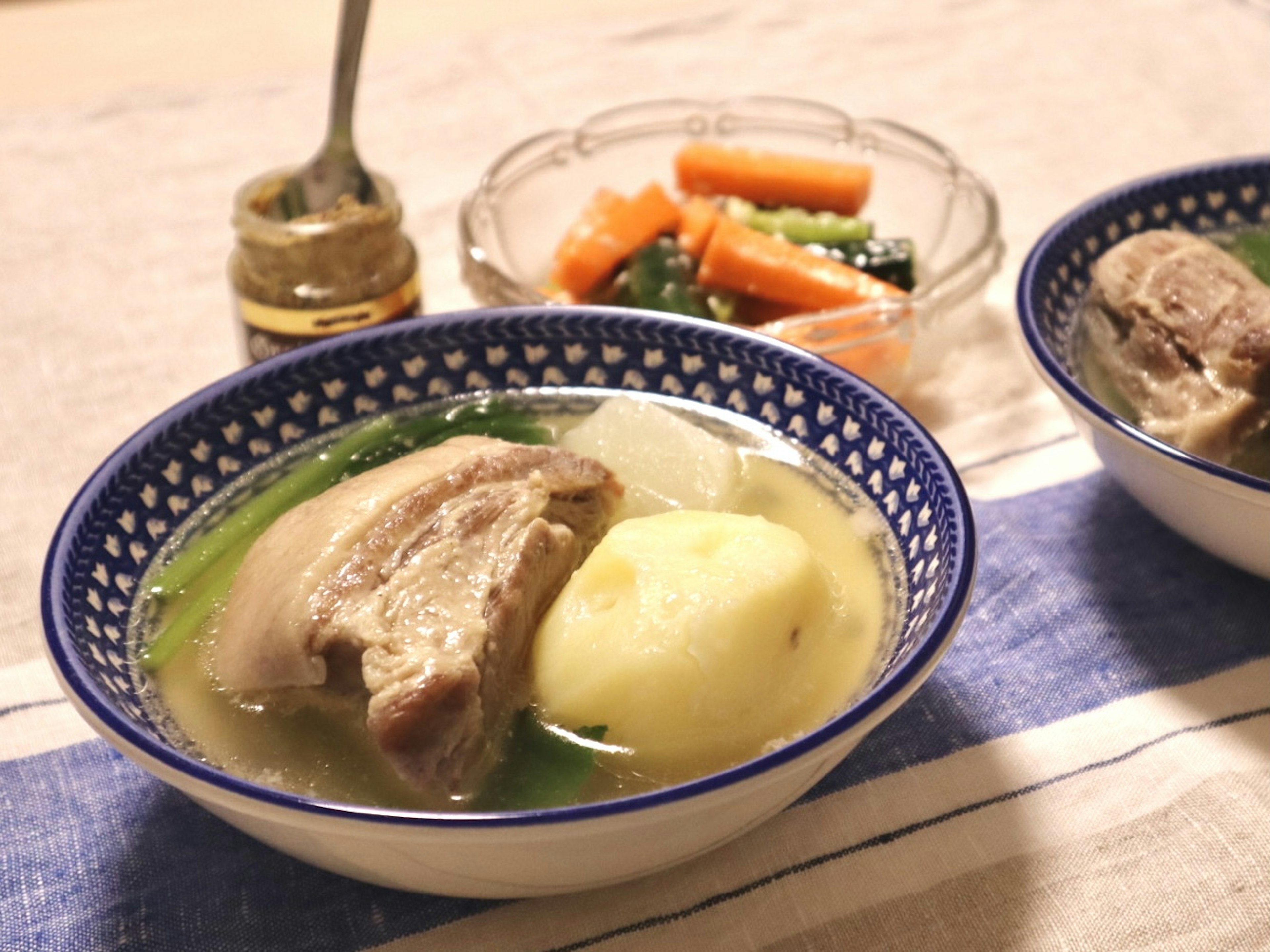 Warm soup with meat and potatoes served in a bowl