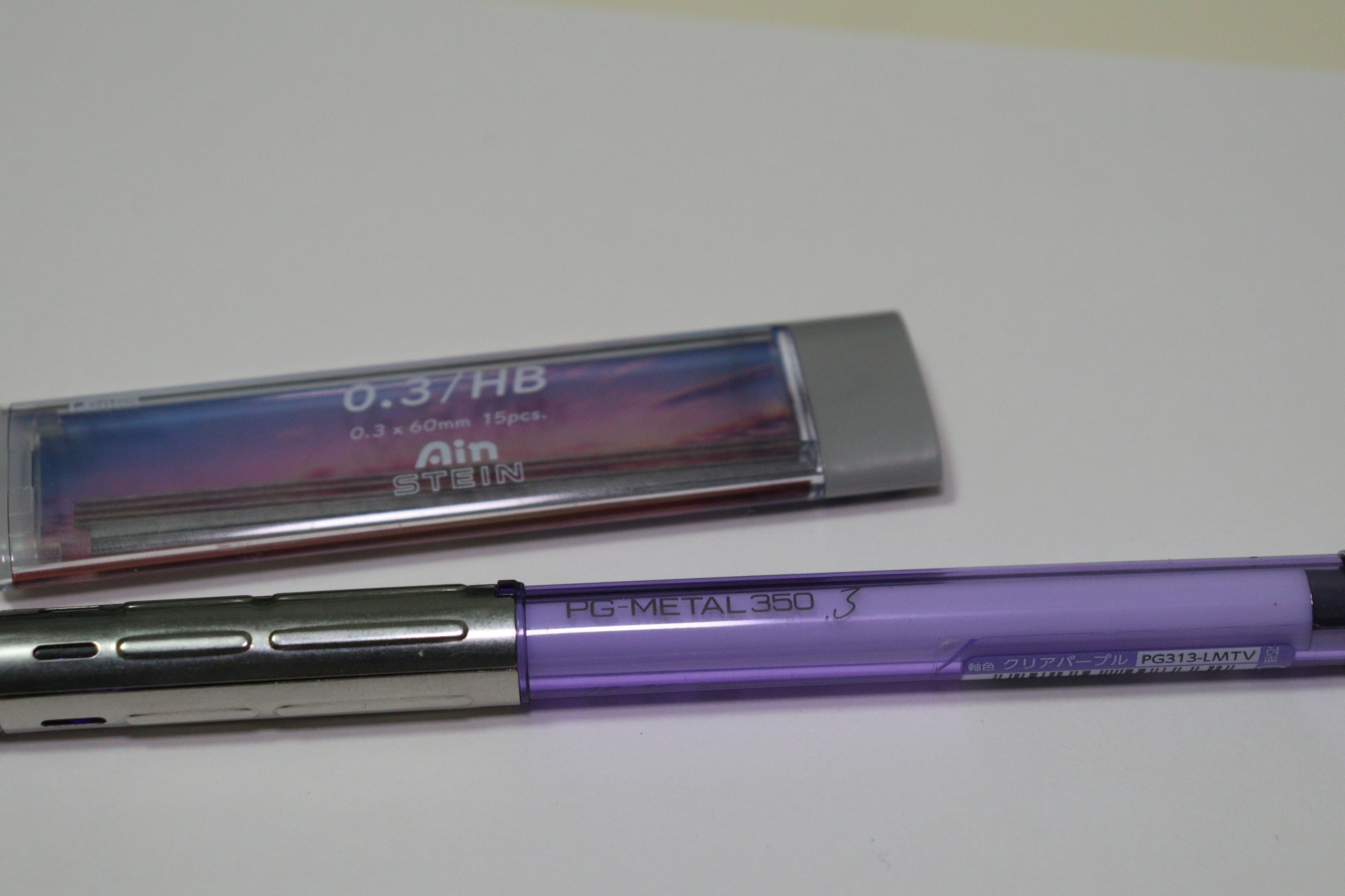 Purple pen alongside its packaging