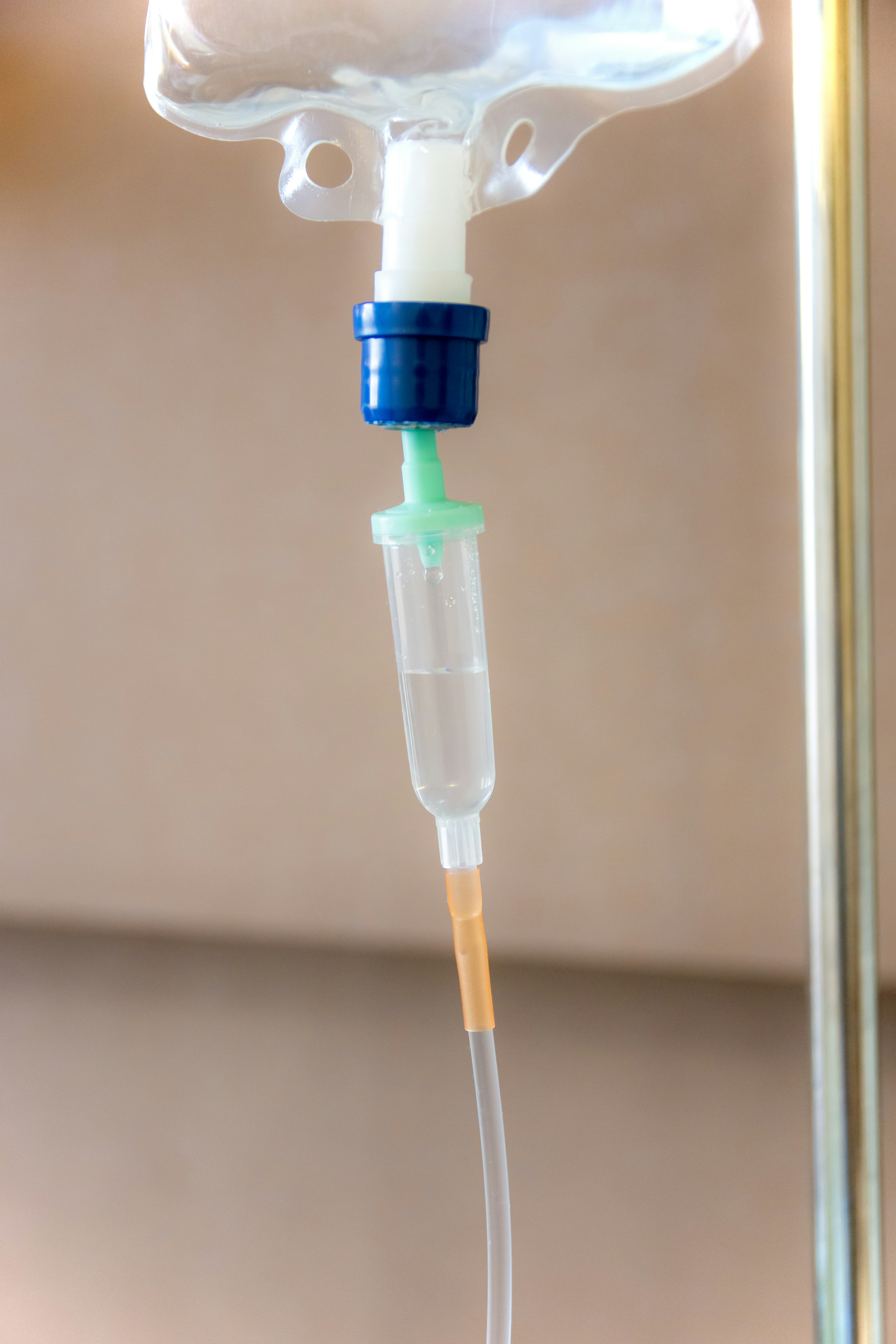 Close-up image of an IV drip tube and valve