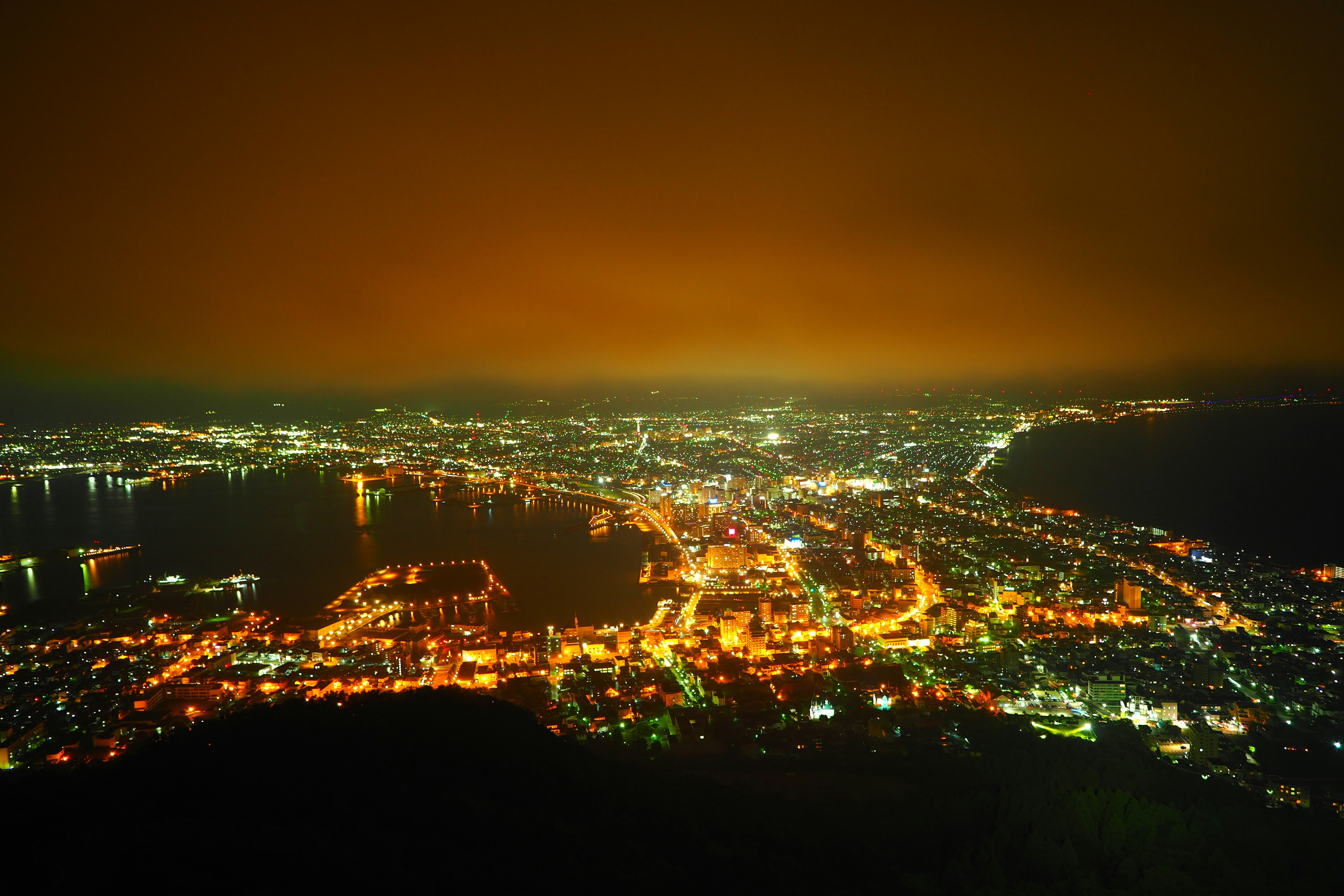 Night cityscape with bright streetlights