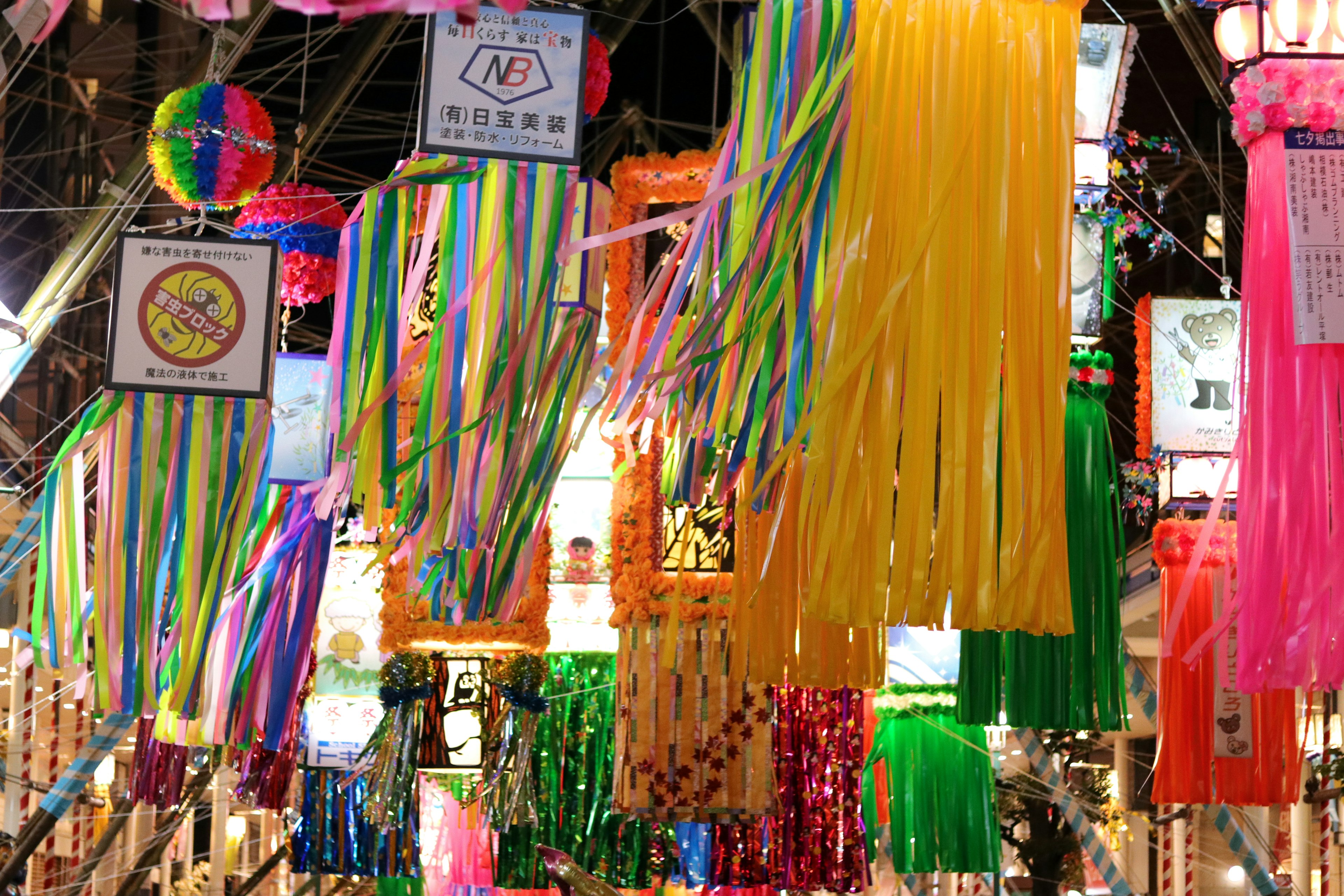 Colorful decorations hanging in a vibrant market scene