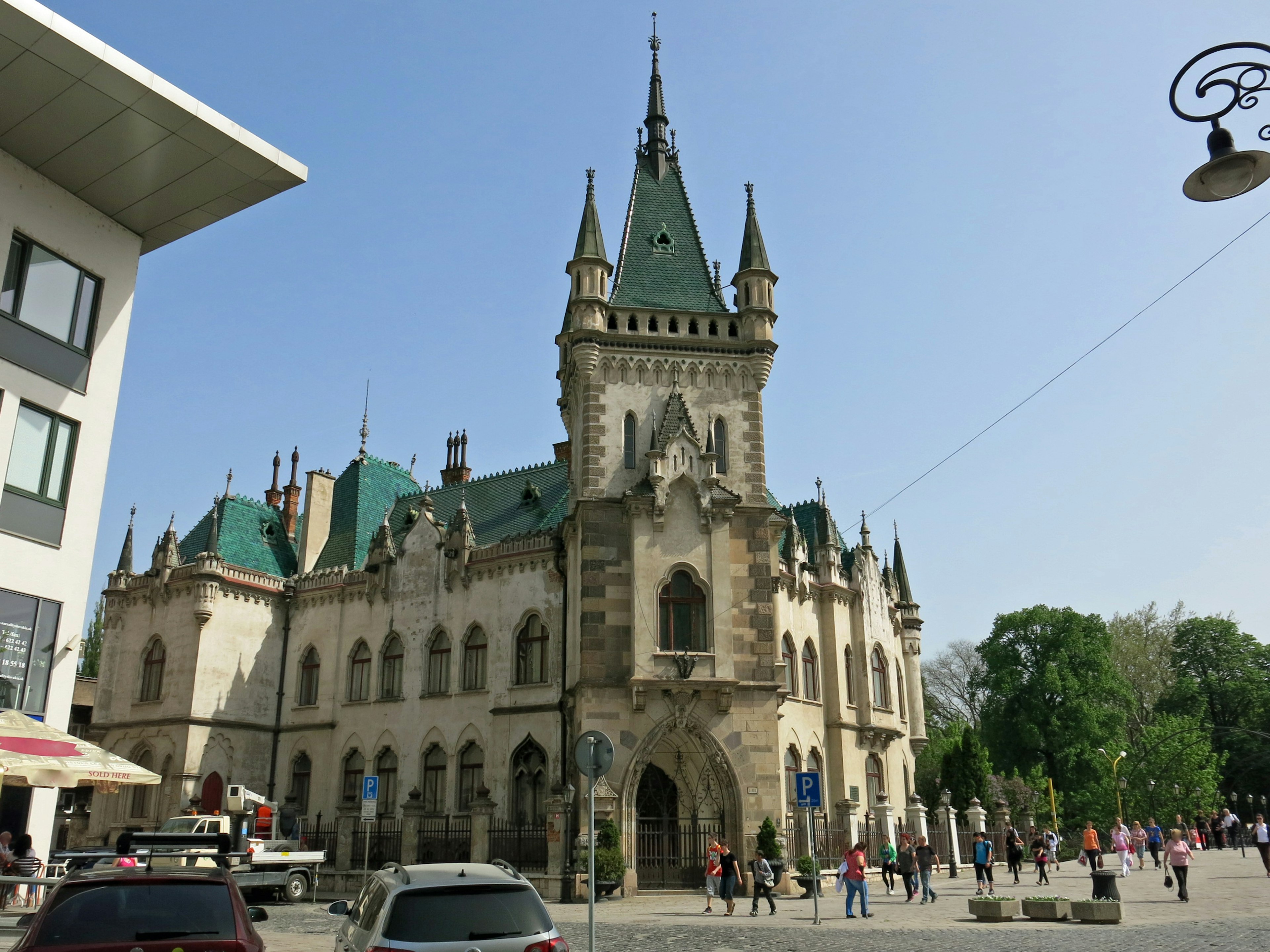 Beautiful Gothic-style building bustling under a blue sky