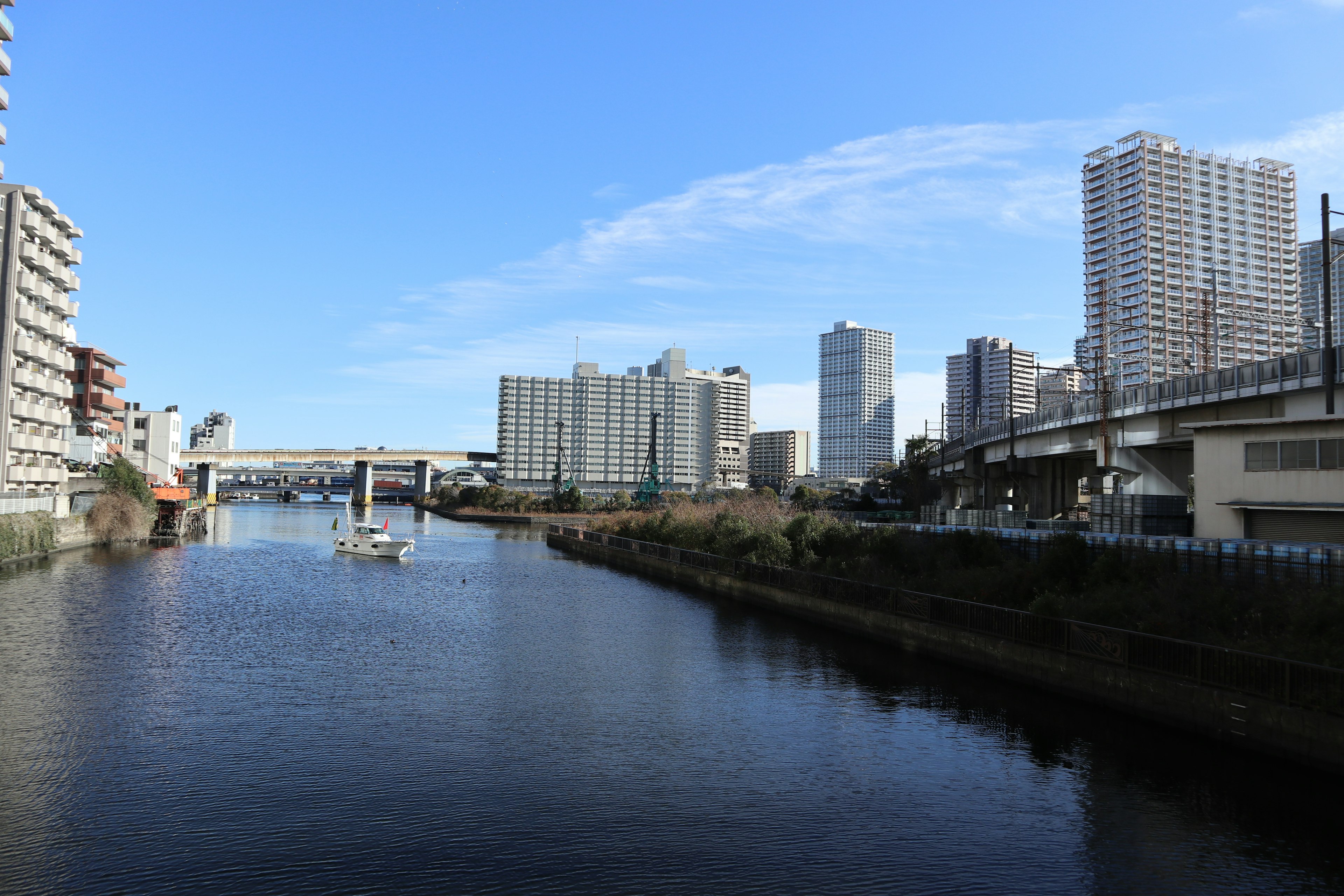 Cityscape featuring a river and skyscrapers