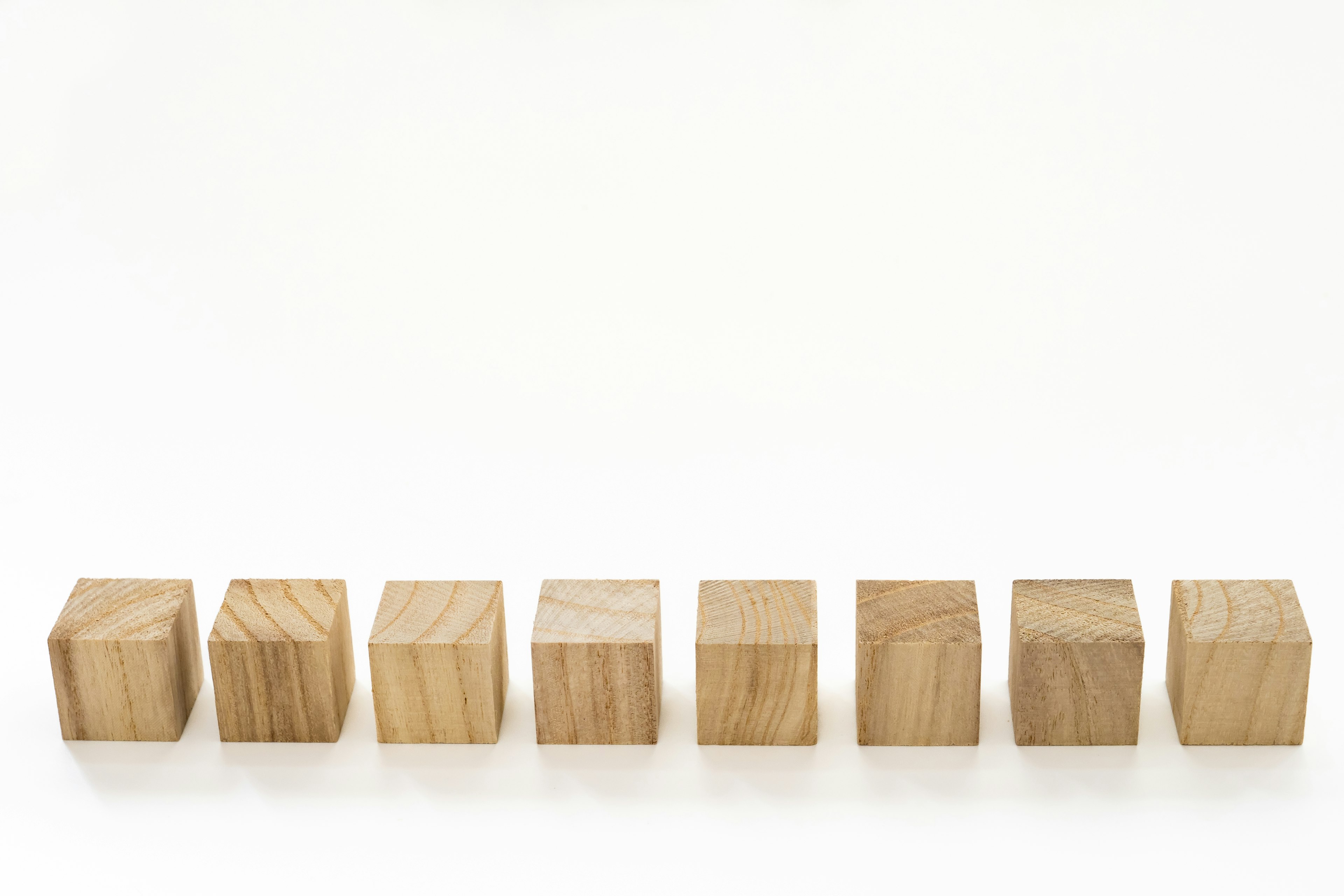 A simple image of wooden cubes arranged in a line