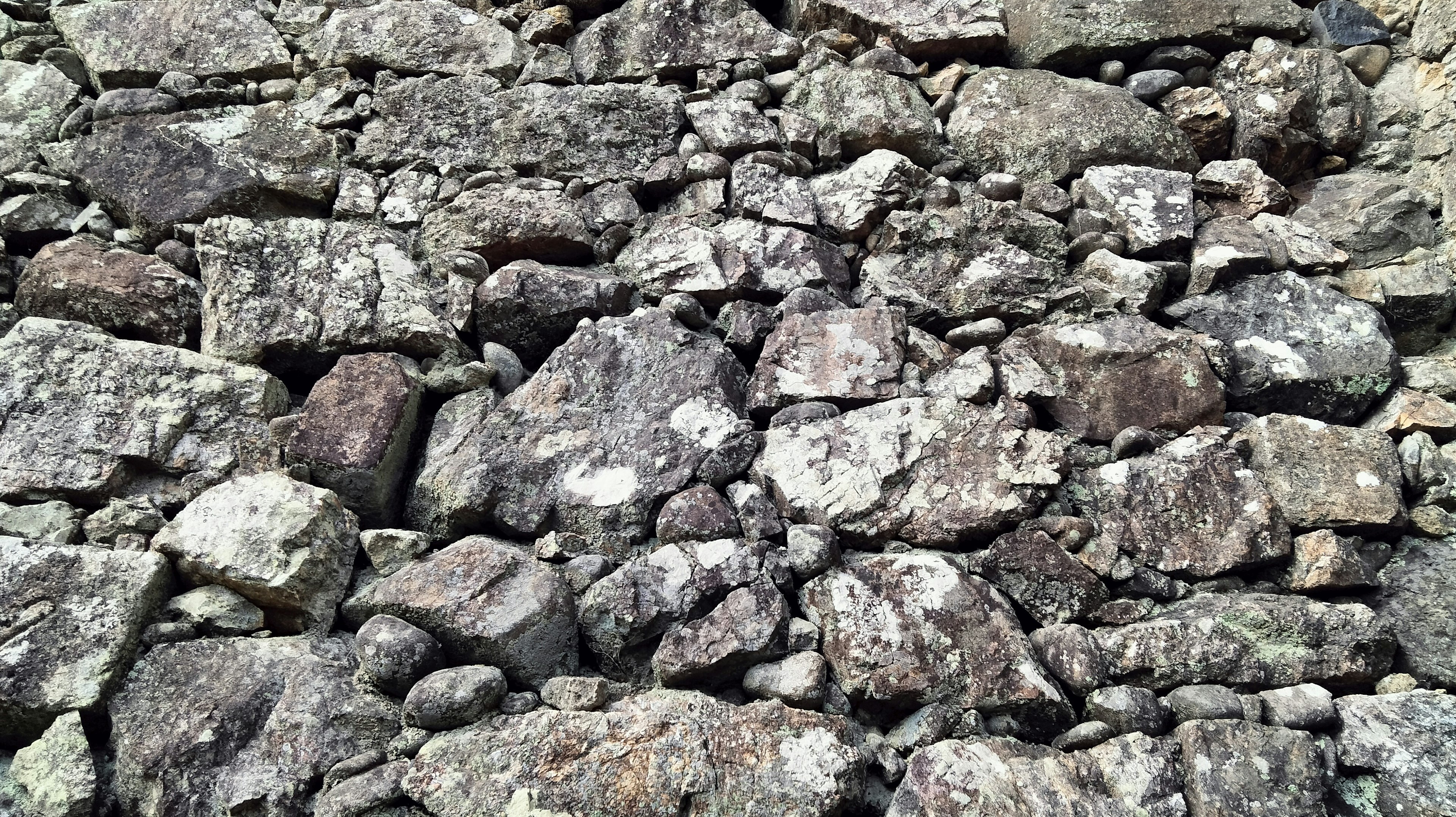 Surface covered with various sizes and colors of rocks