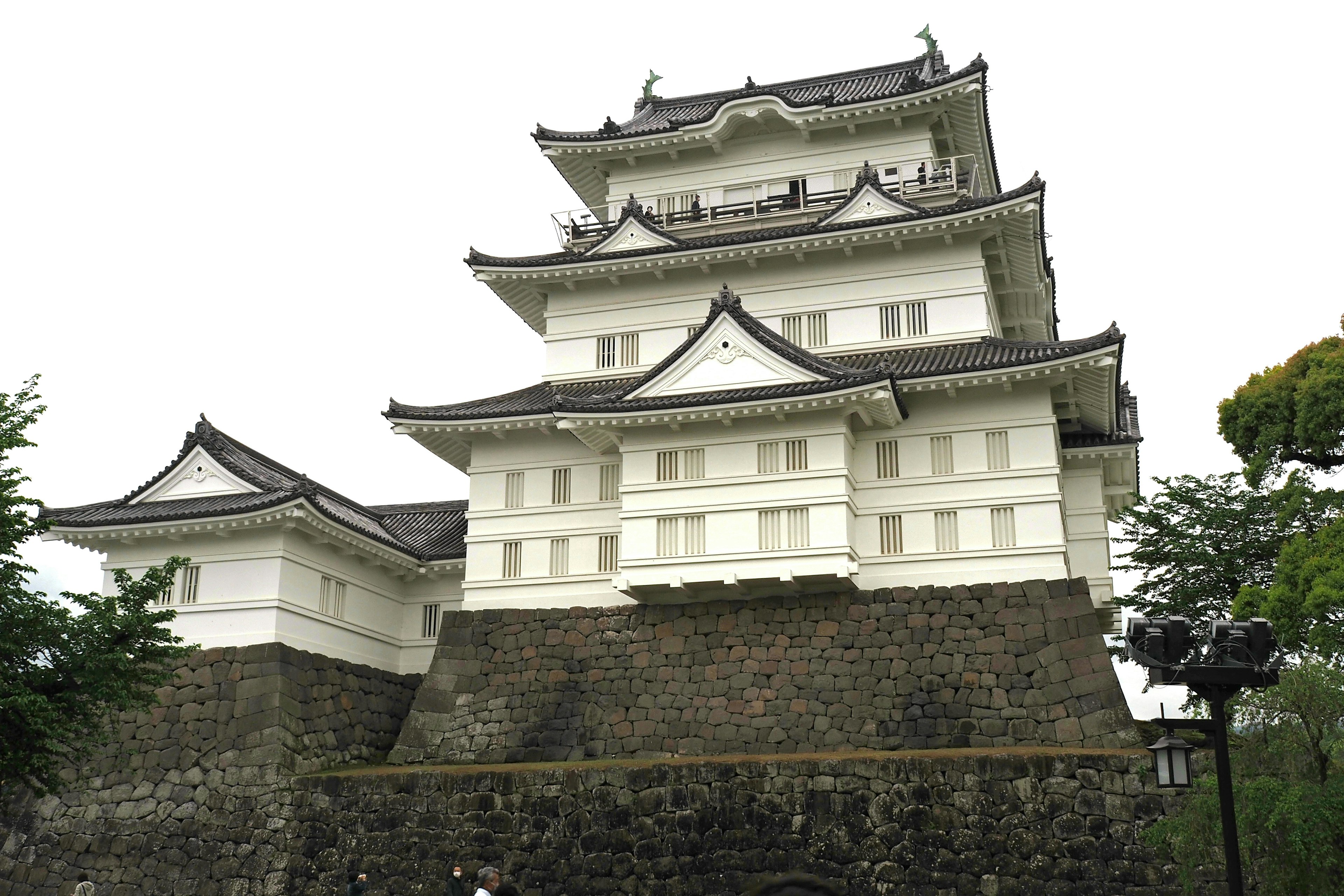 A white castle structure on top of a stone base