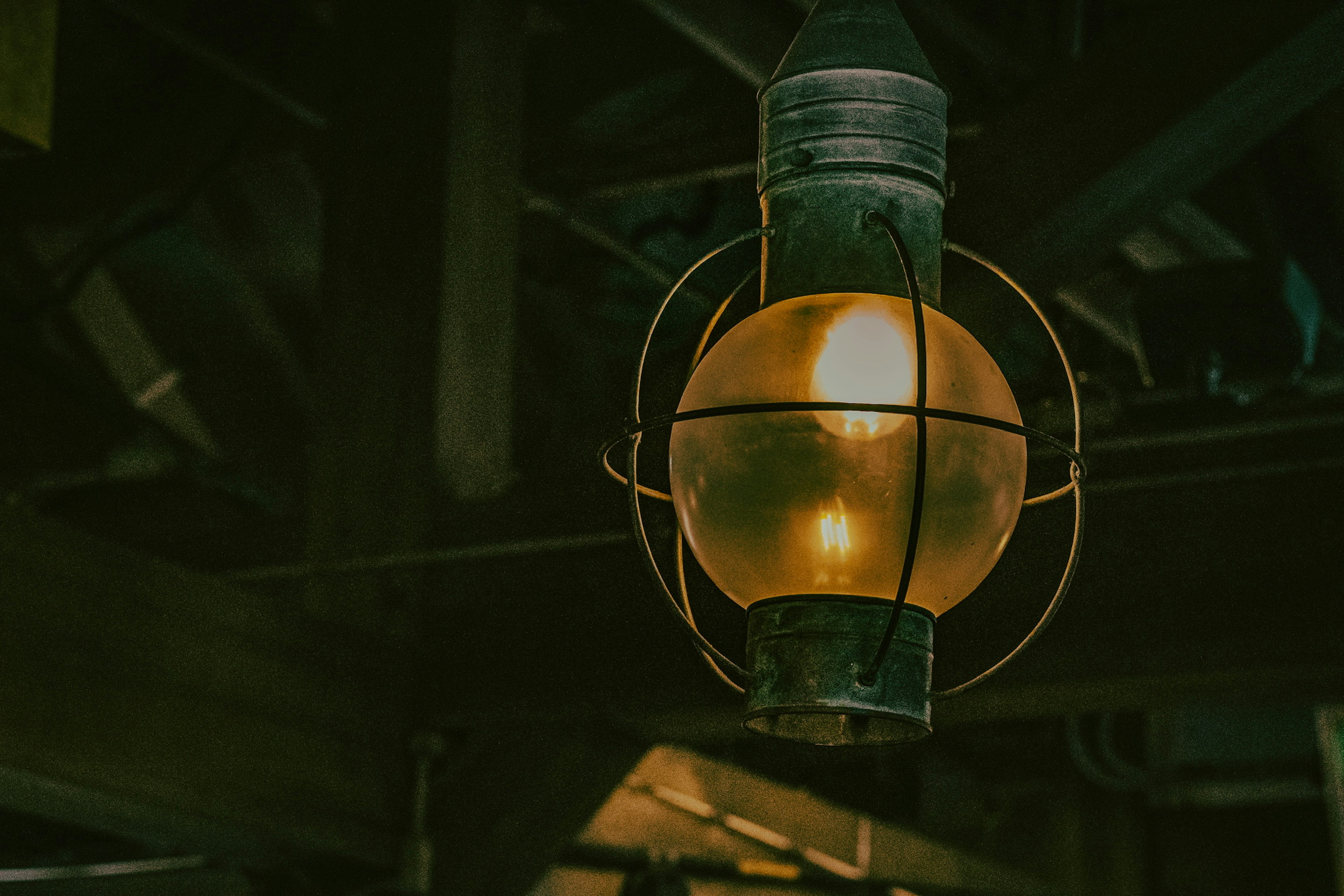 Vintage lantern hanging in a dimly lit environment