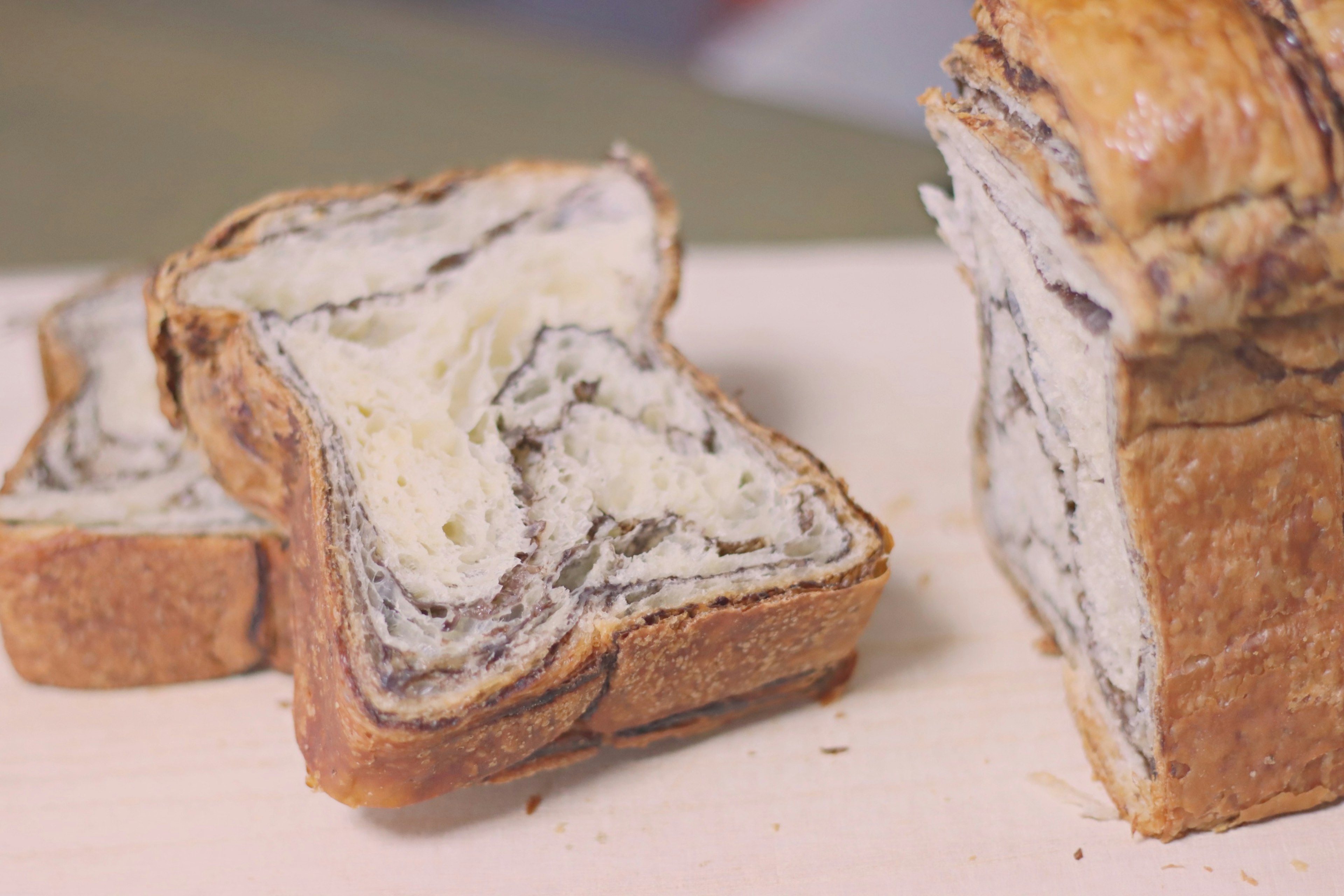 Sliced marble bread on a wooden board with visible swirls