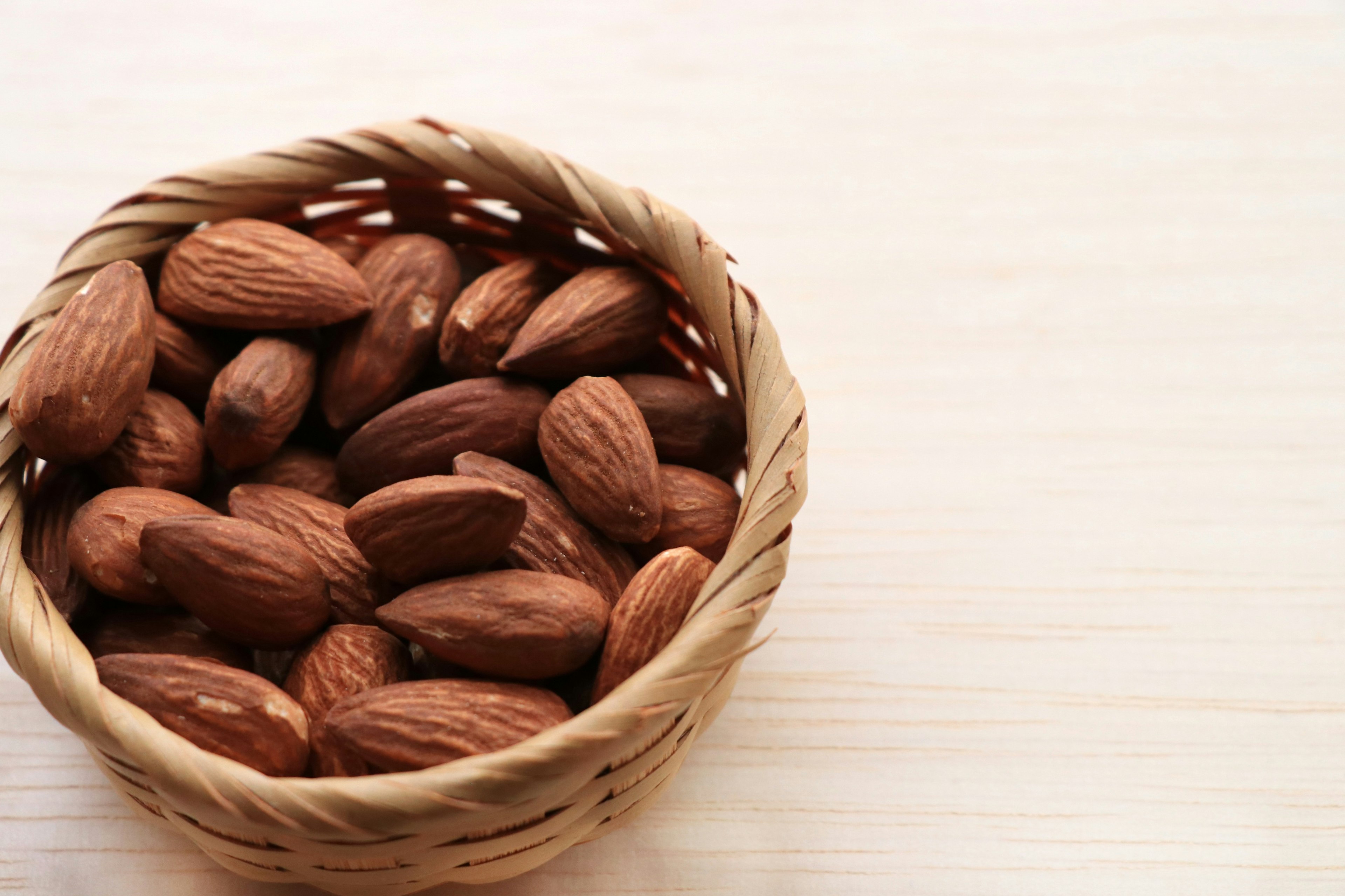 Close-up of almonds in a wicker basket