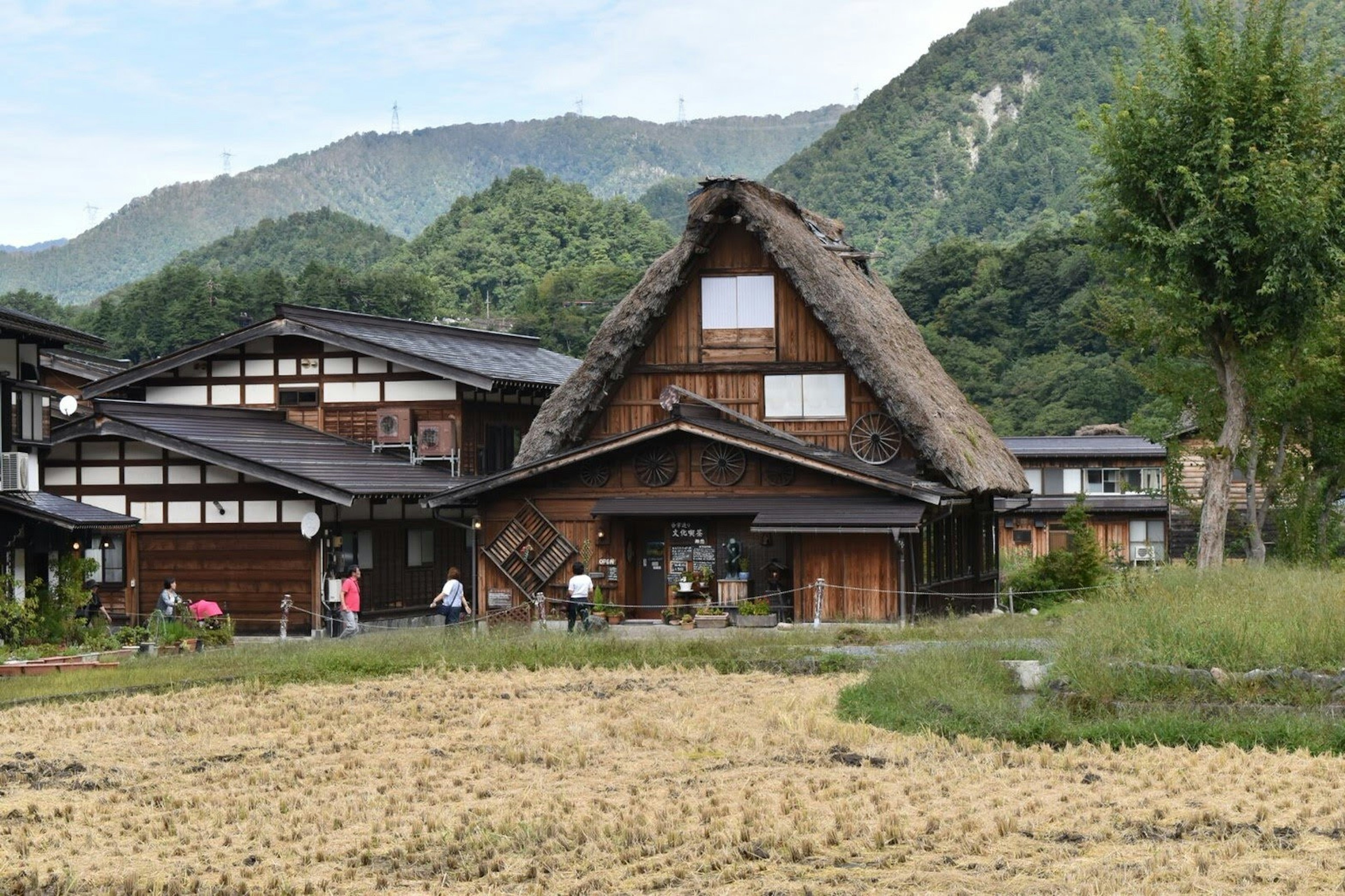 Traditional gassho-zukuri house in Japan with surrounding mountains