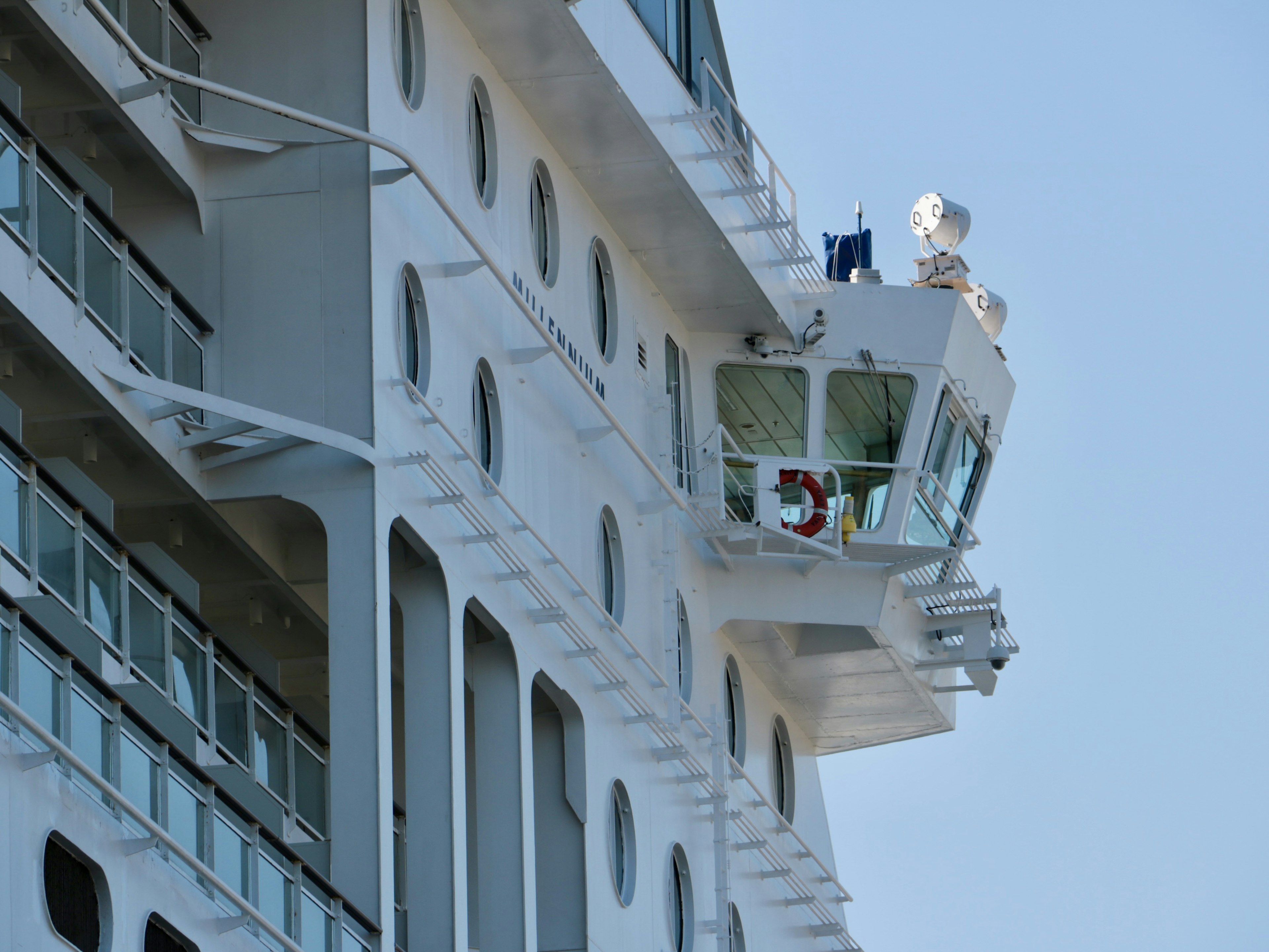 Bridge of a large cruise ship with a white hull