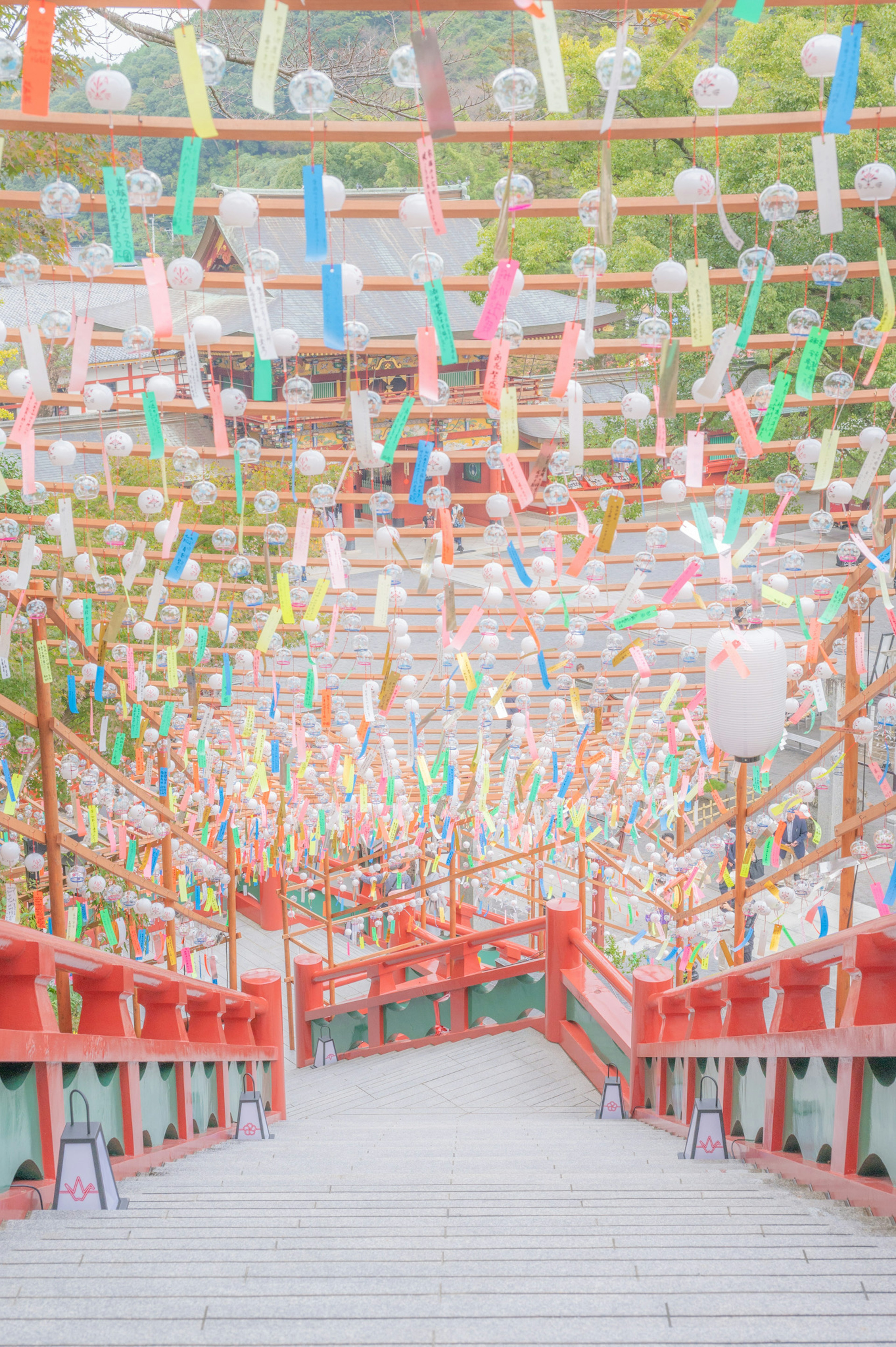 Colorful decorations on a staircase leading to a shrine