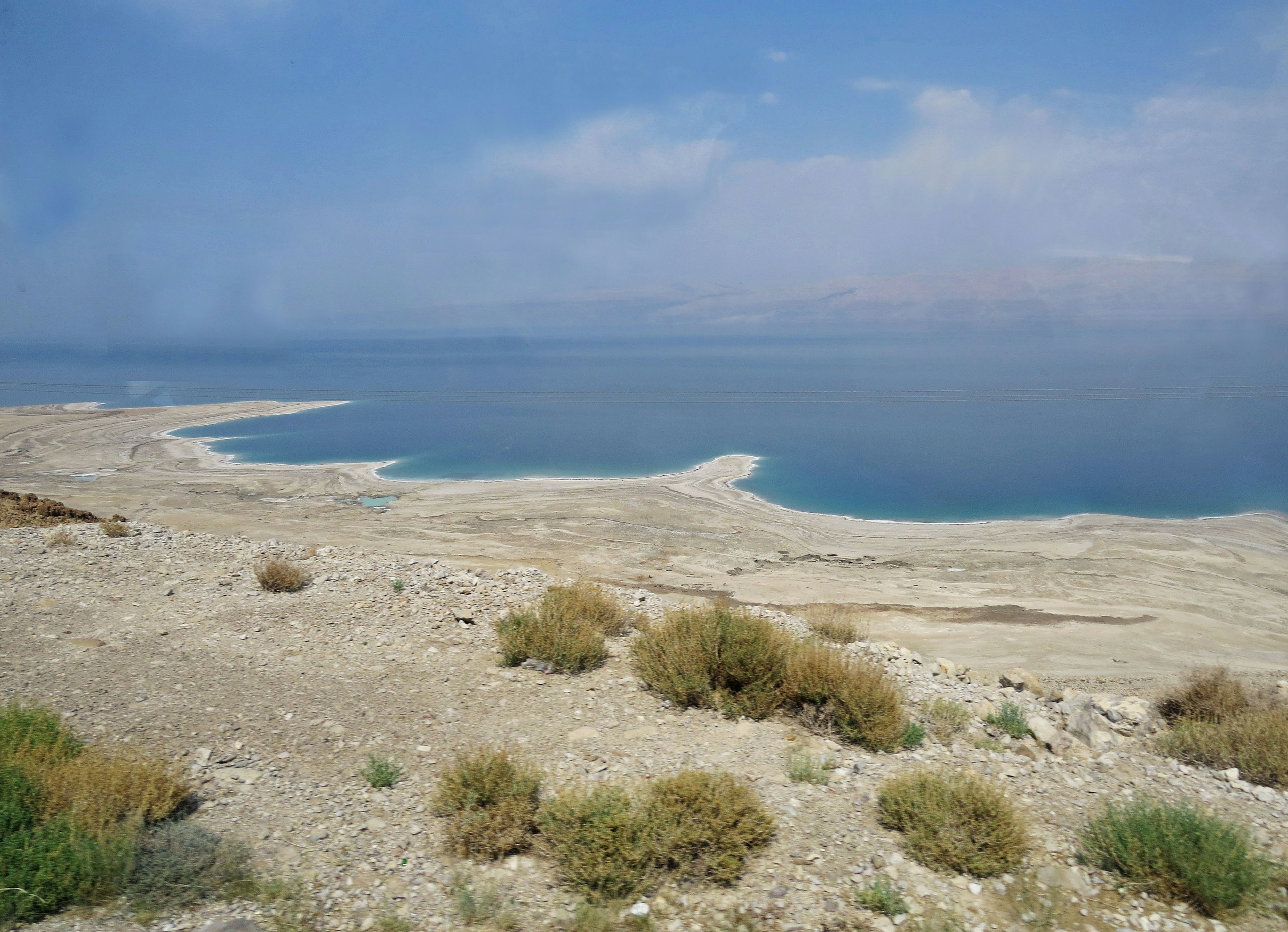 Scenic view of the Dead Sea with dry terrain