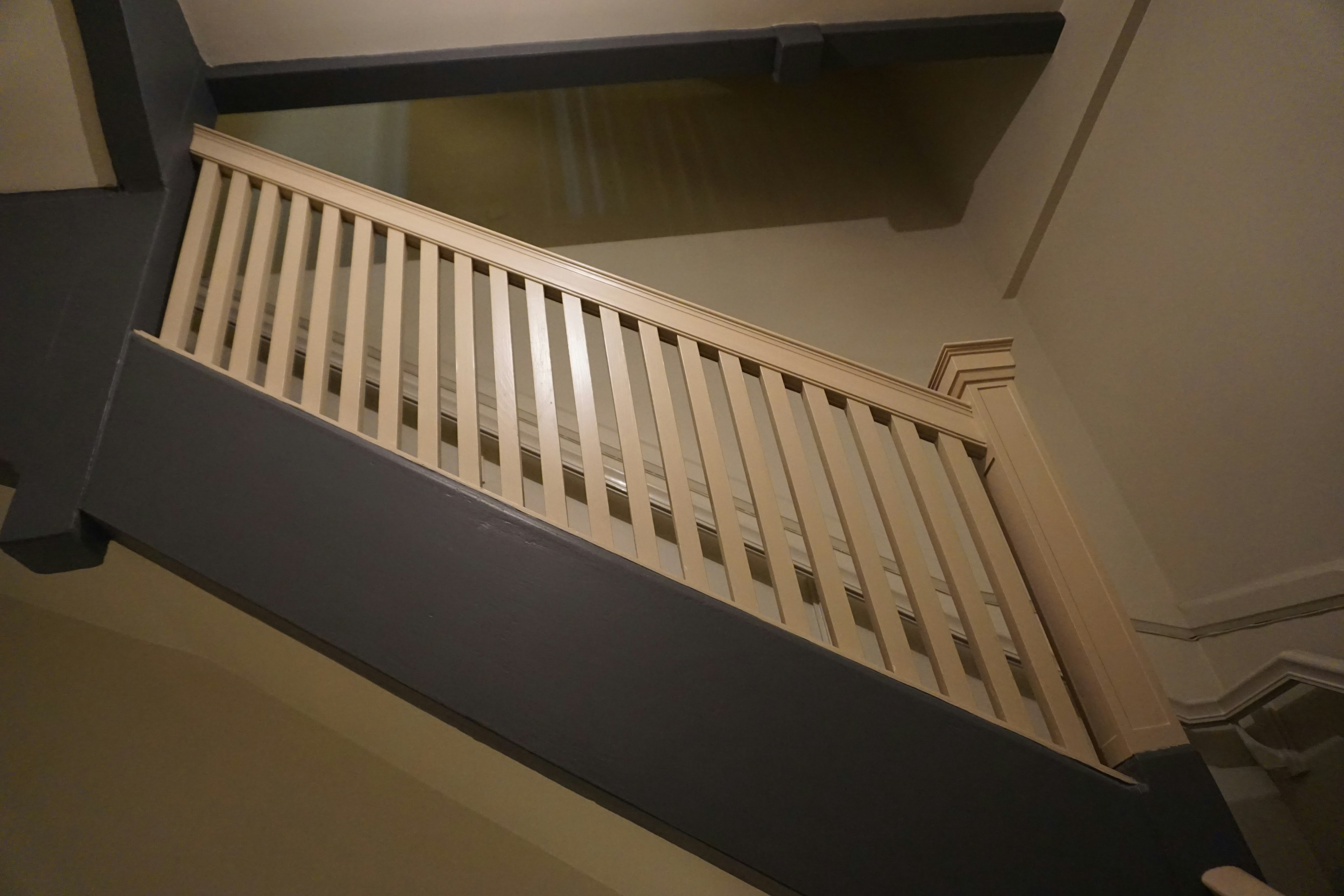 Modern interior staircase with wooden railing