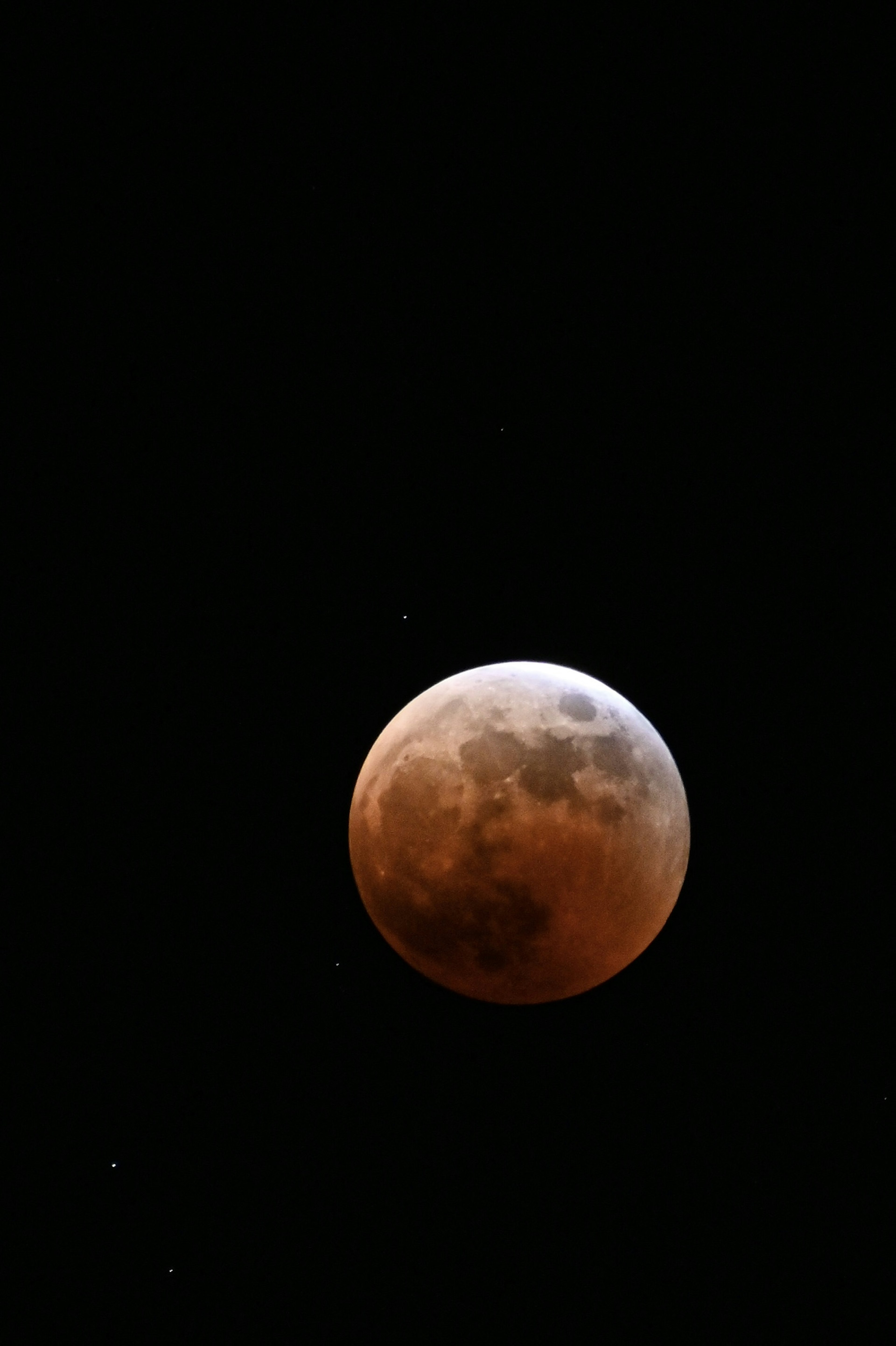 Partial lunar eclipse with a dark background