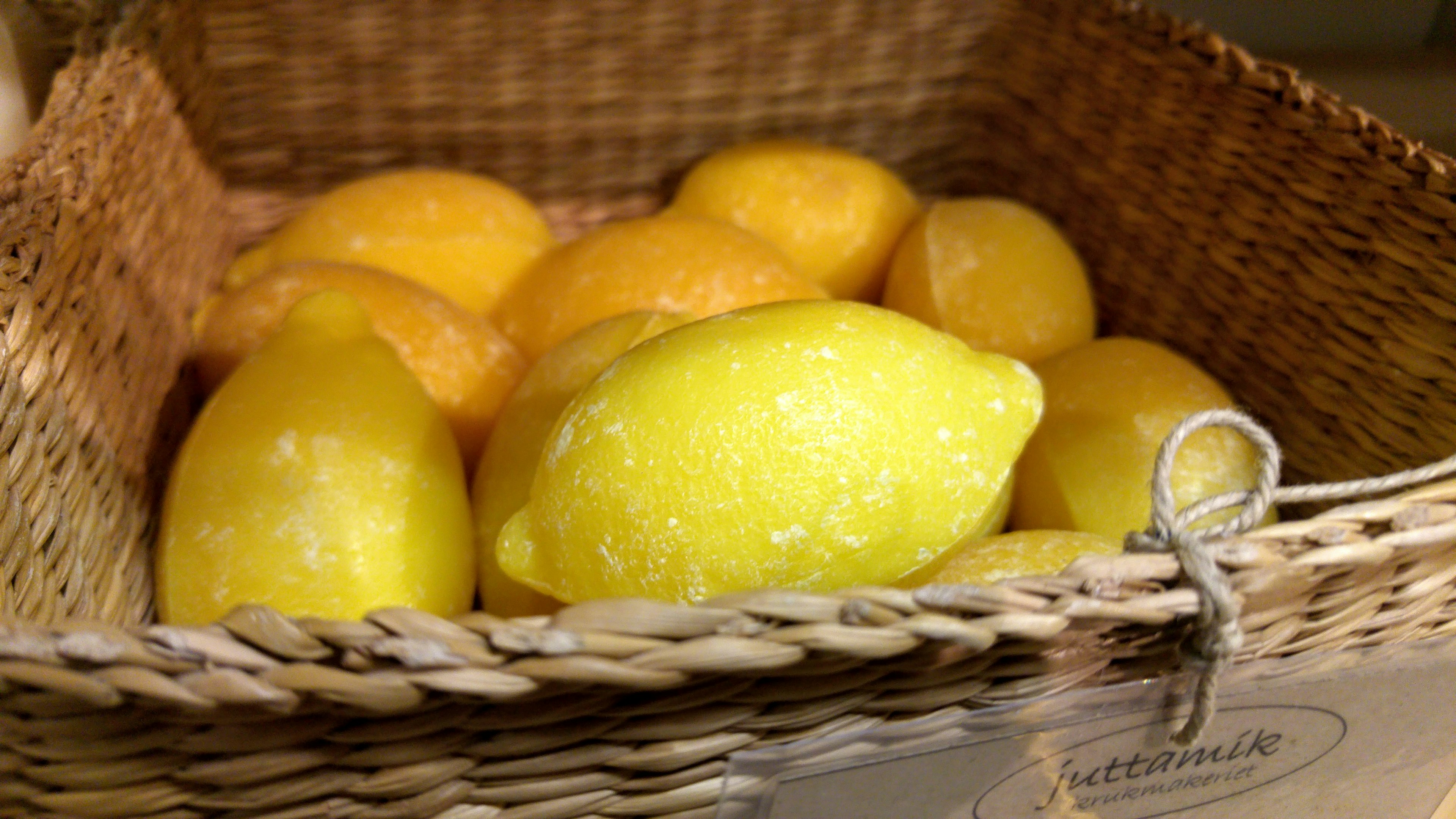 Fresh lemons in a woven basket