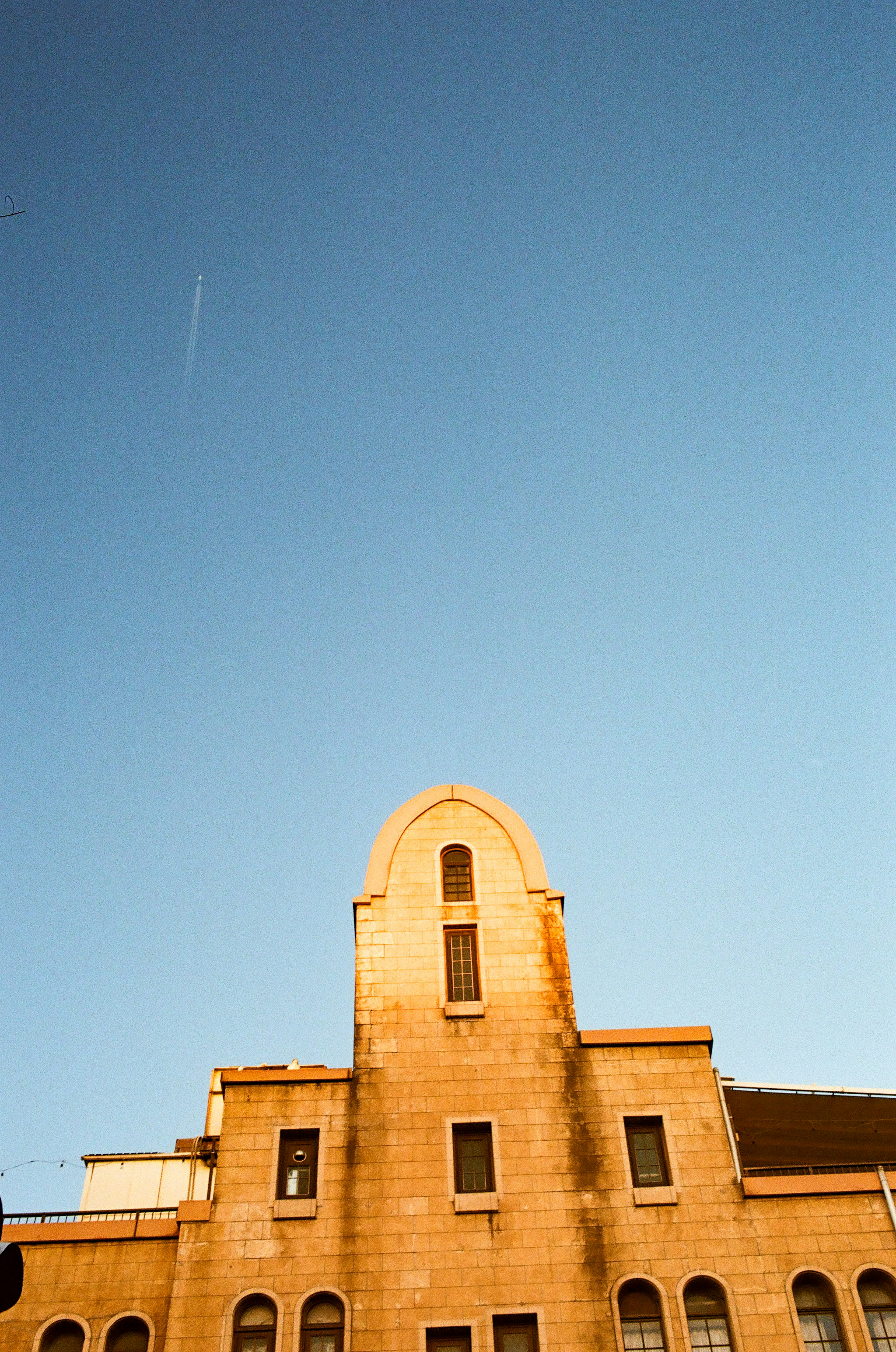 Facade of a historic building under a clear blue sky