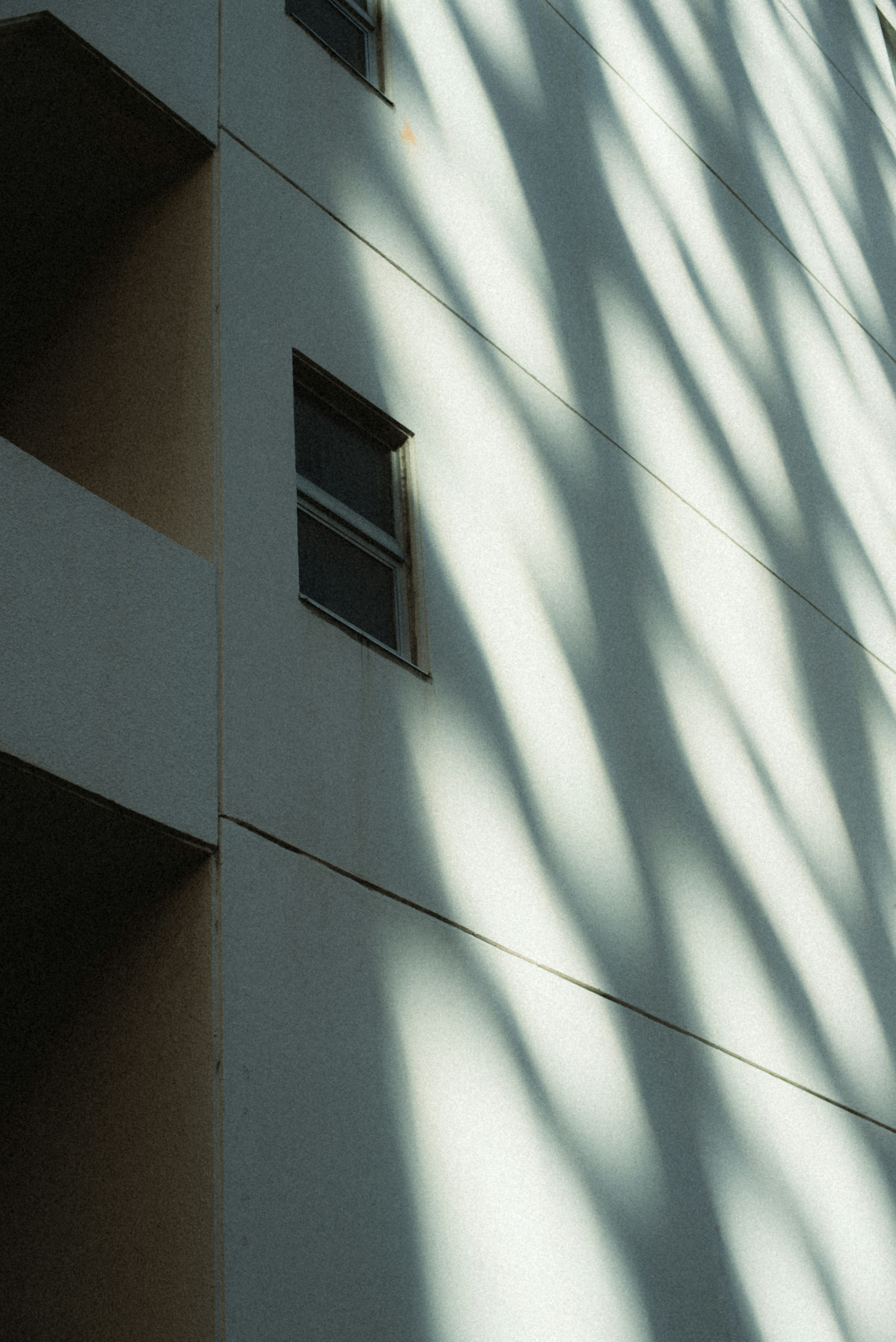 Building wall with shadows from light