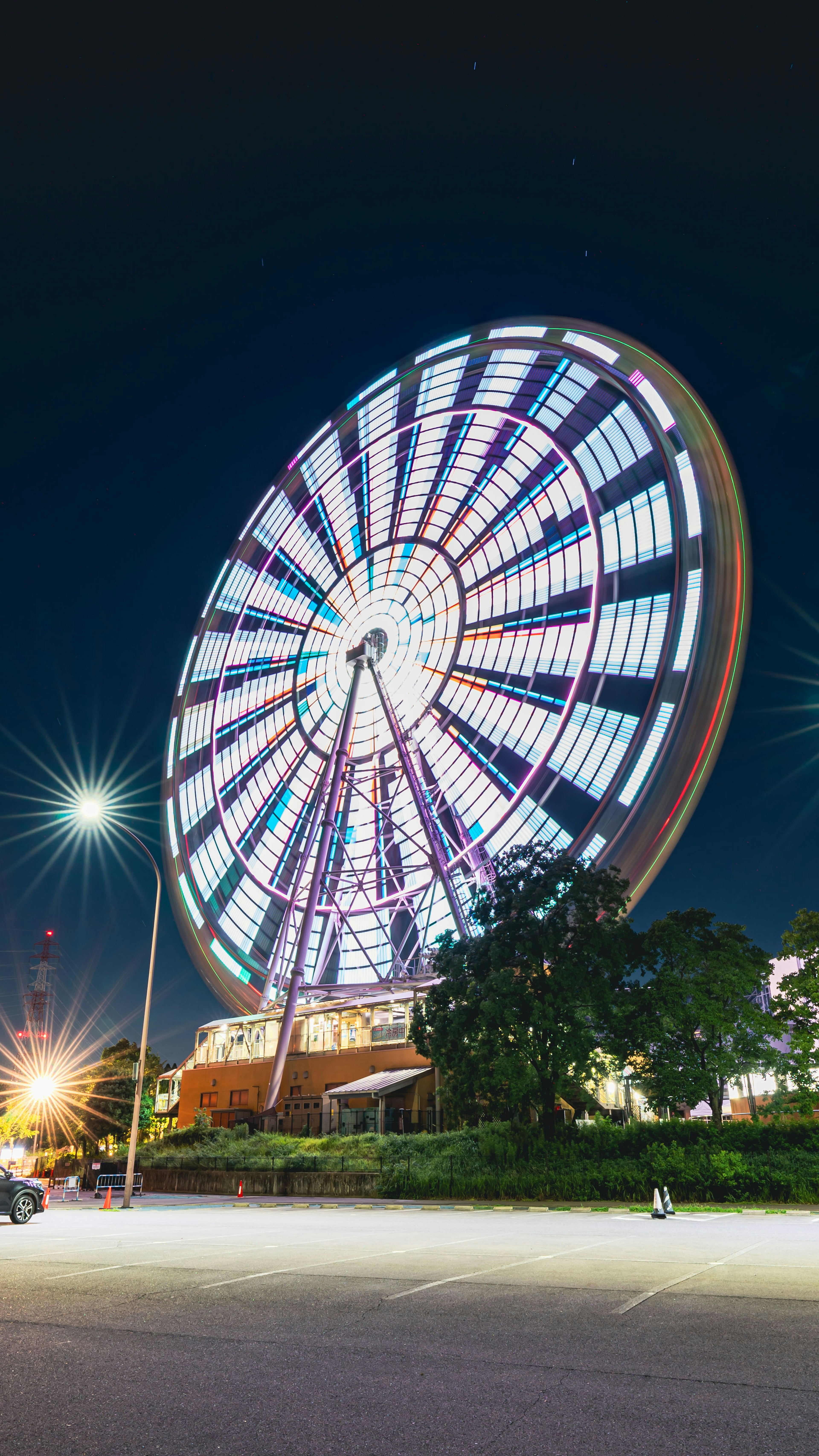 Large illuminated Ferris wheel at night