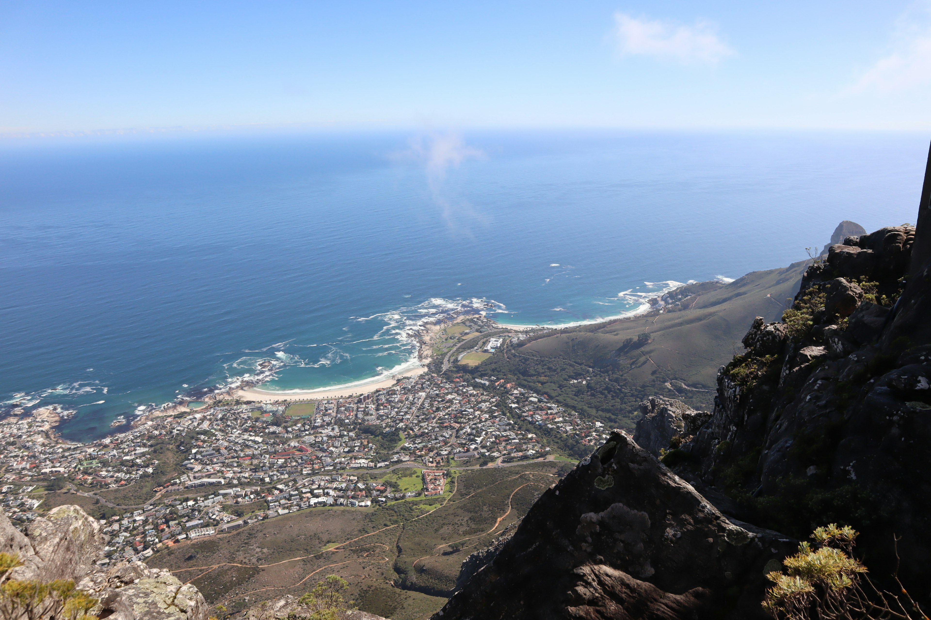 View from the top of a mountain overlooking Cape Town's beautiful coastline