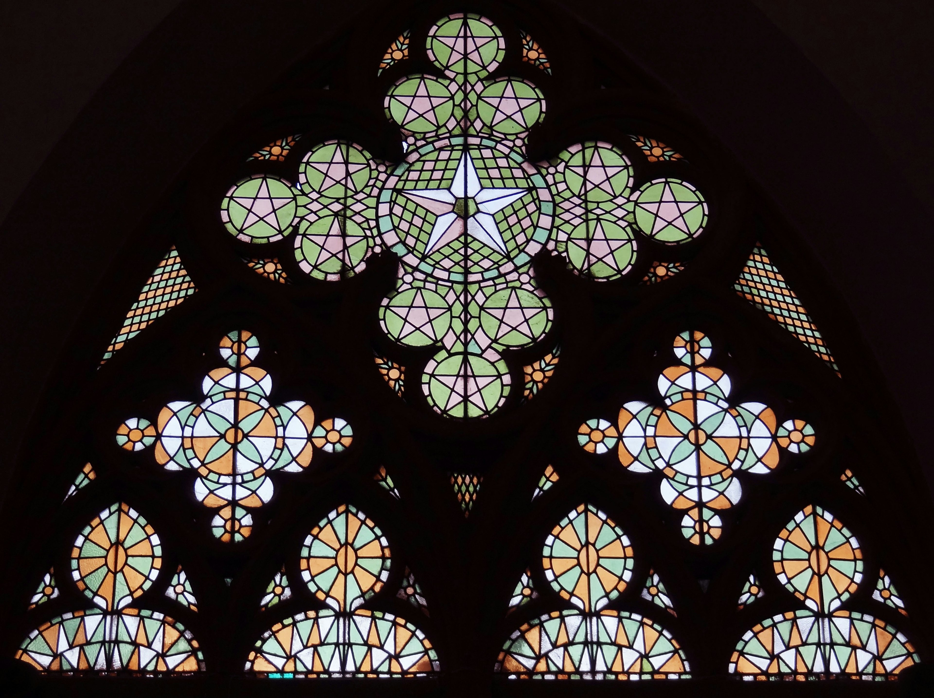 Beautiful stained glass window featuring colorful geometric patterns