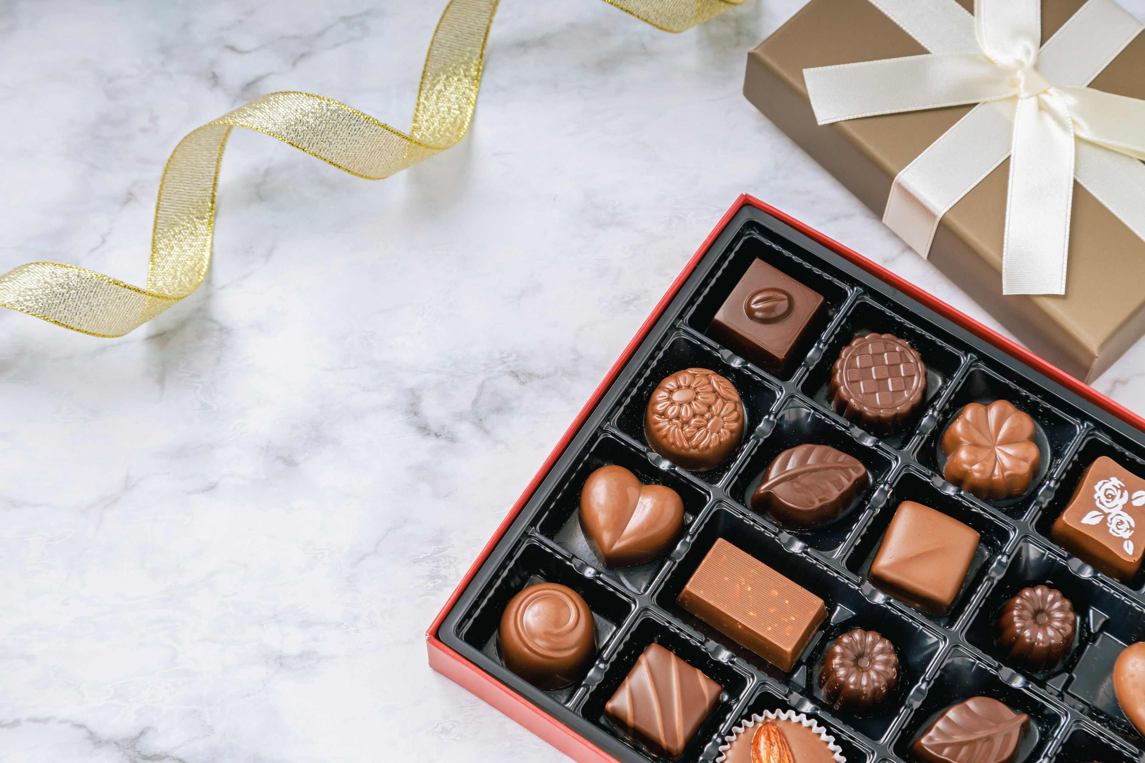 Beautiful assortment of chocolates in a gift box with a ribbon