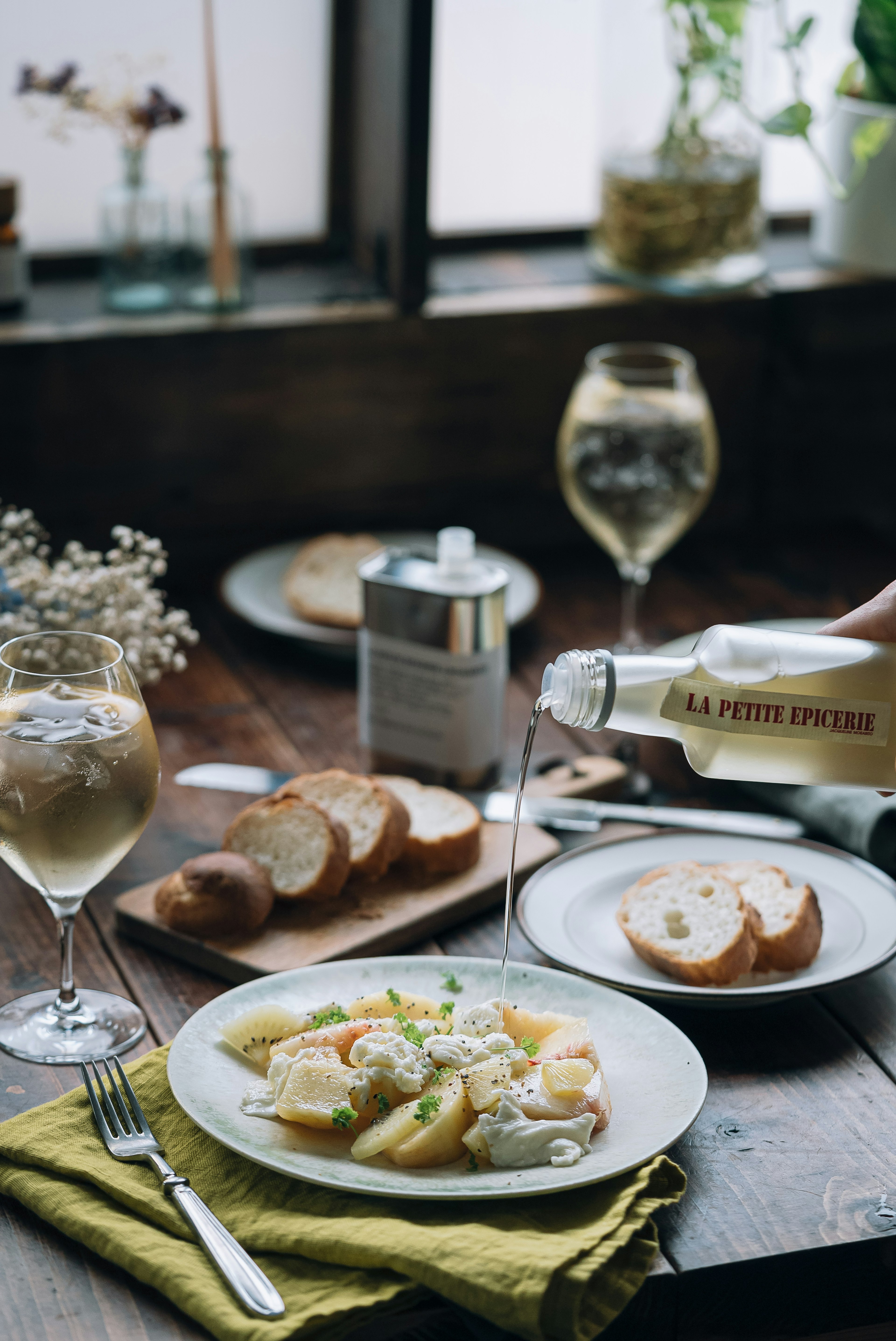 A beautifully arranged table featuring pasta salad and bread