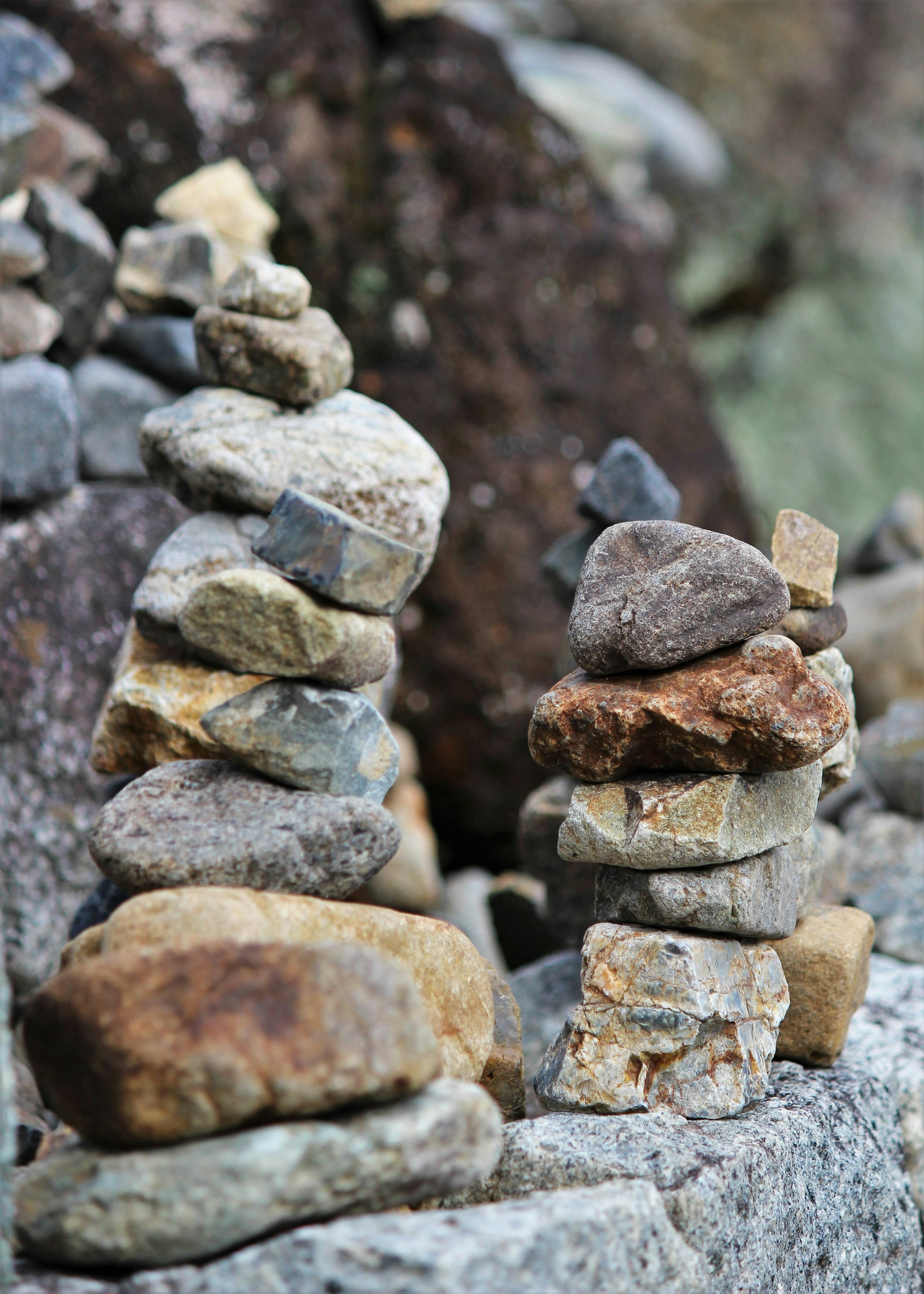 Two stone towers stacked in a natural setting