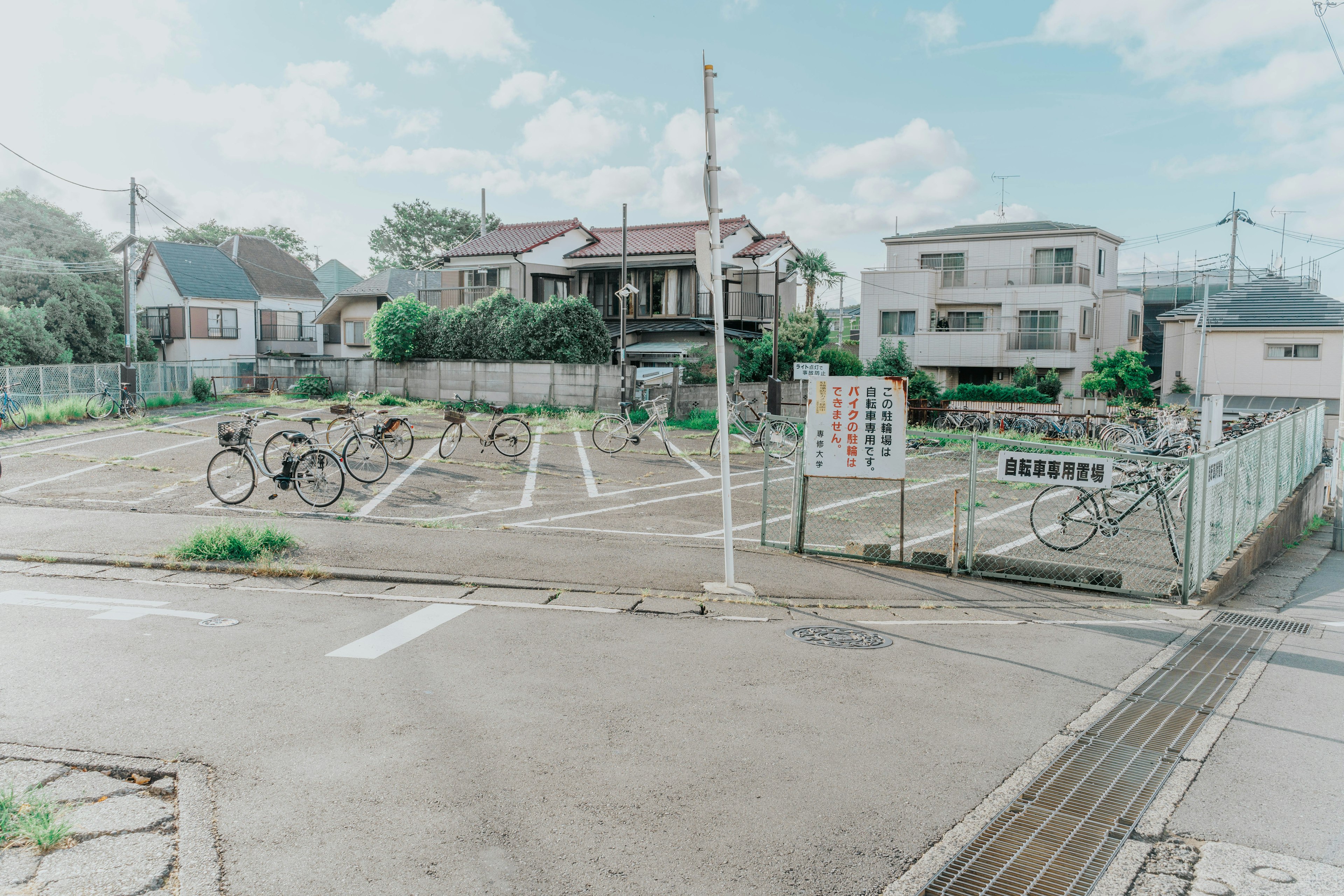 Spacious parking lot with surrounding houses