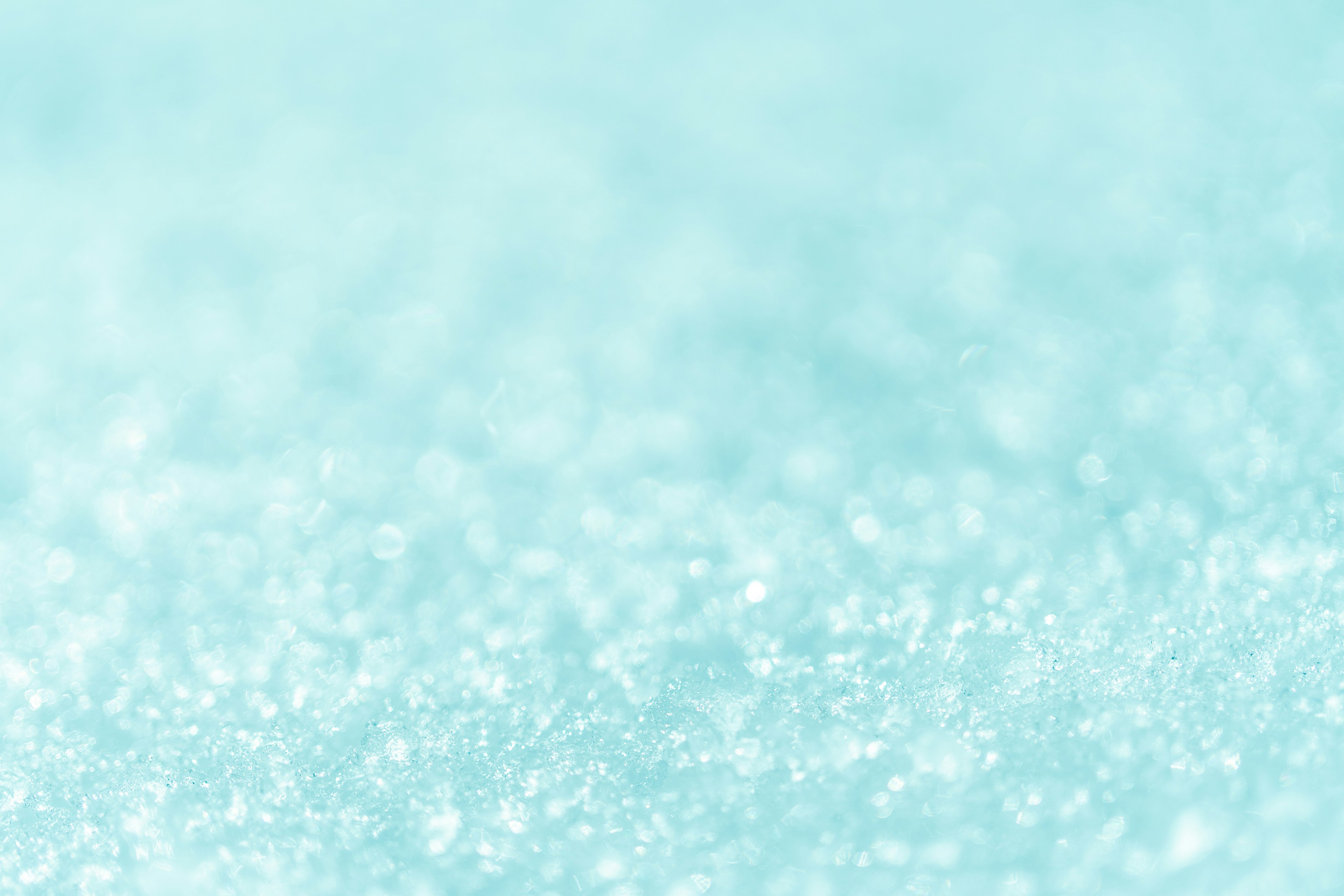 Soft blue background with sparkling crystalline texture