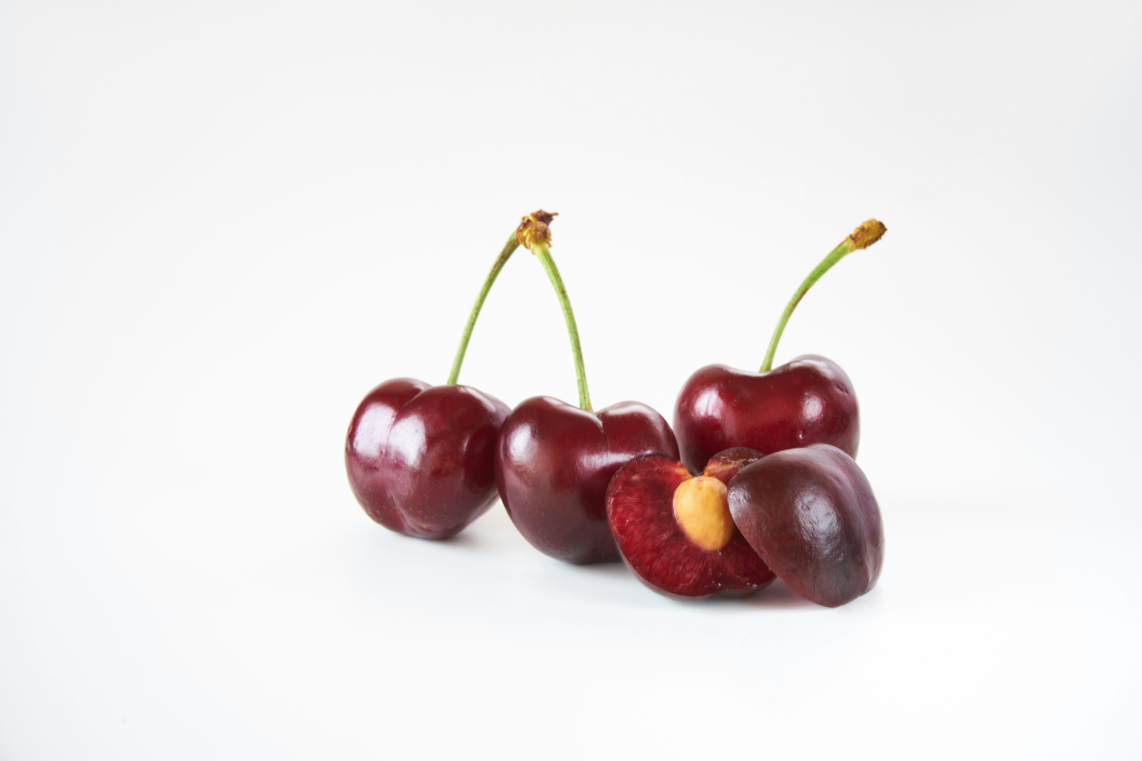 Fresh cherries with a cut showcasing the inside