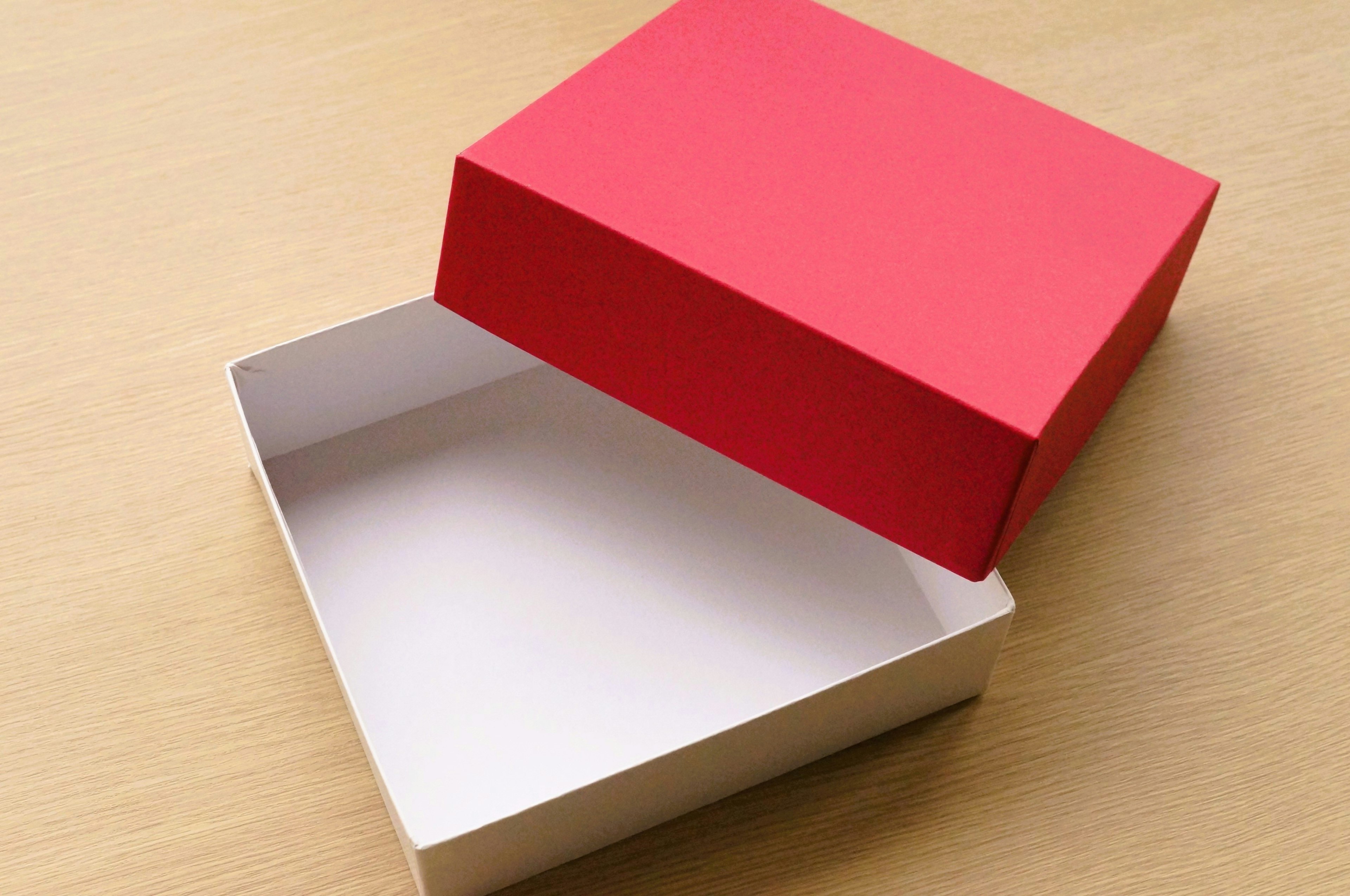 Red lid on a white box