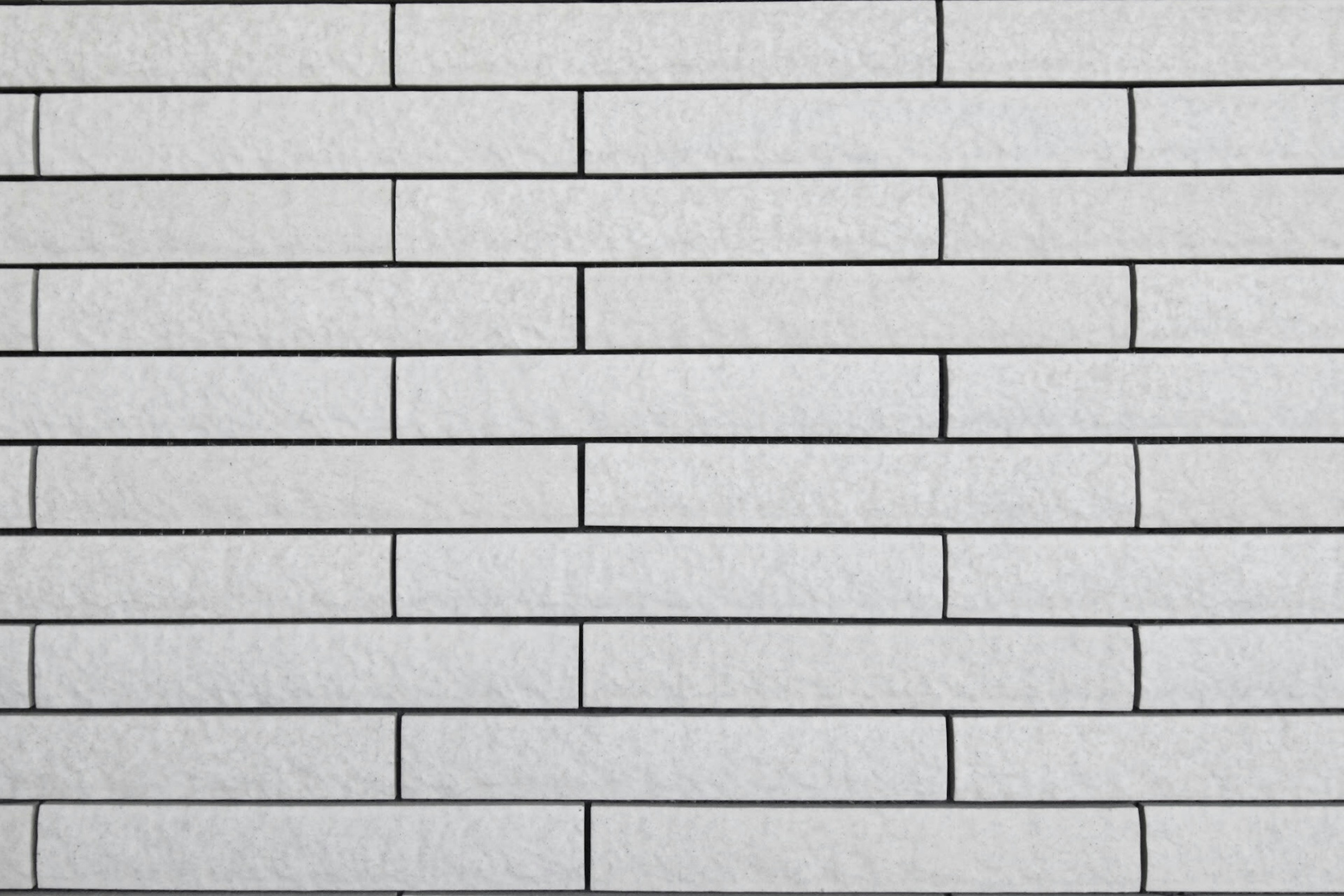 A neatly arranged white brick wall