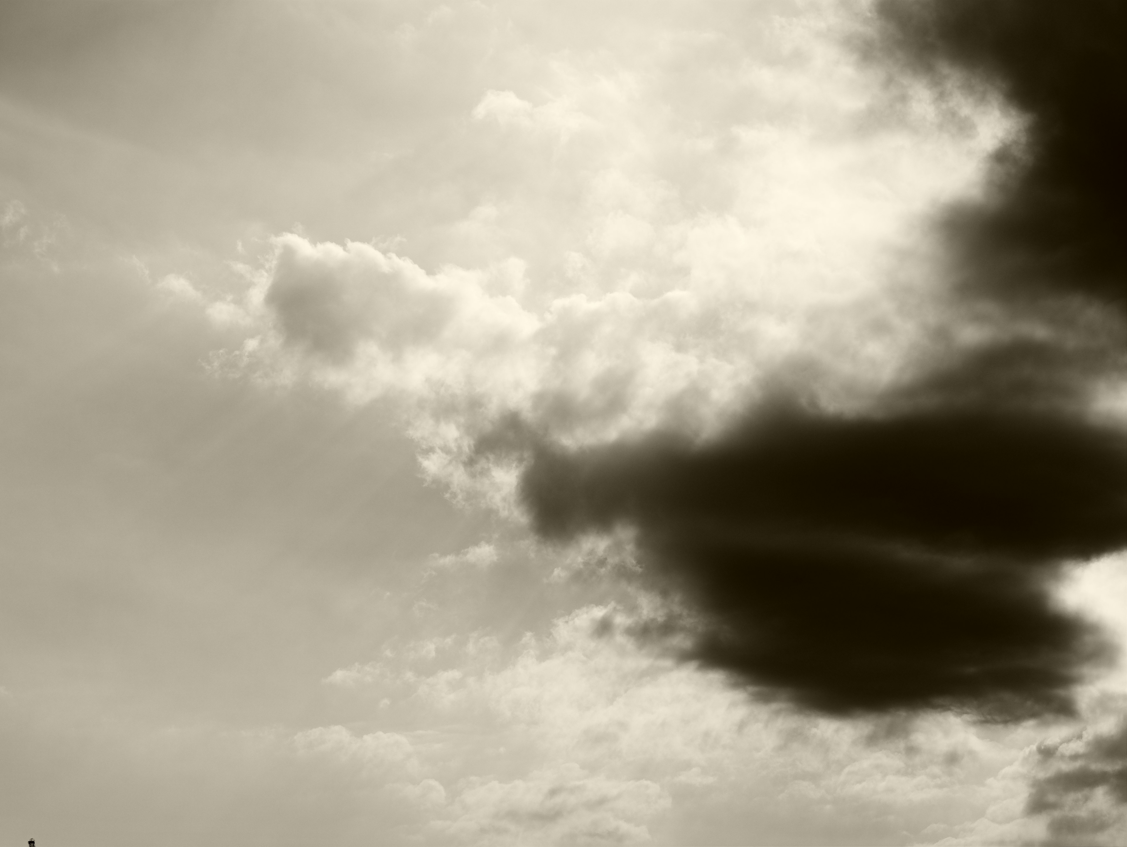 High-contrast black and white clouds in the sky