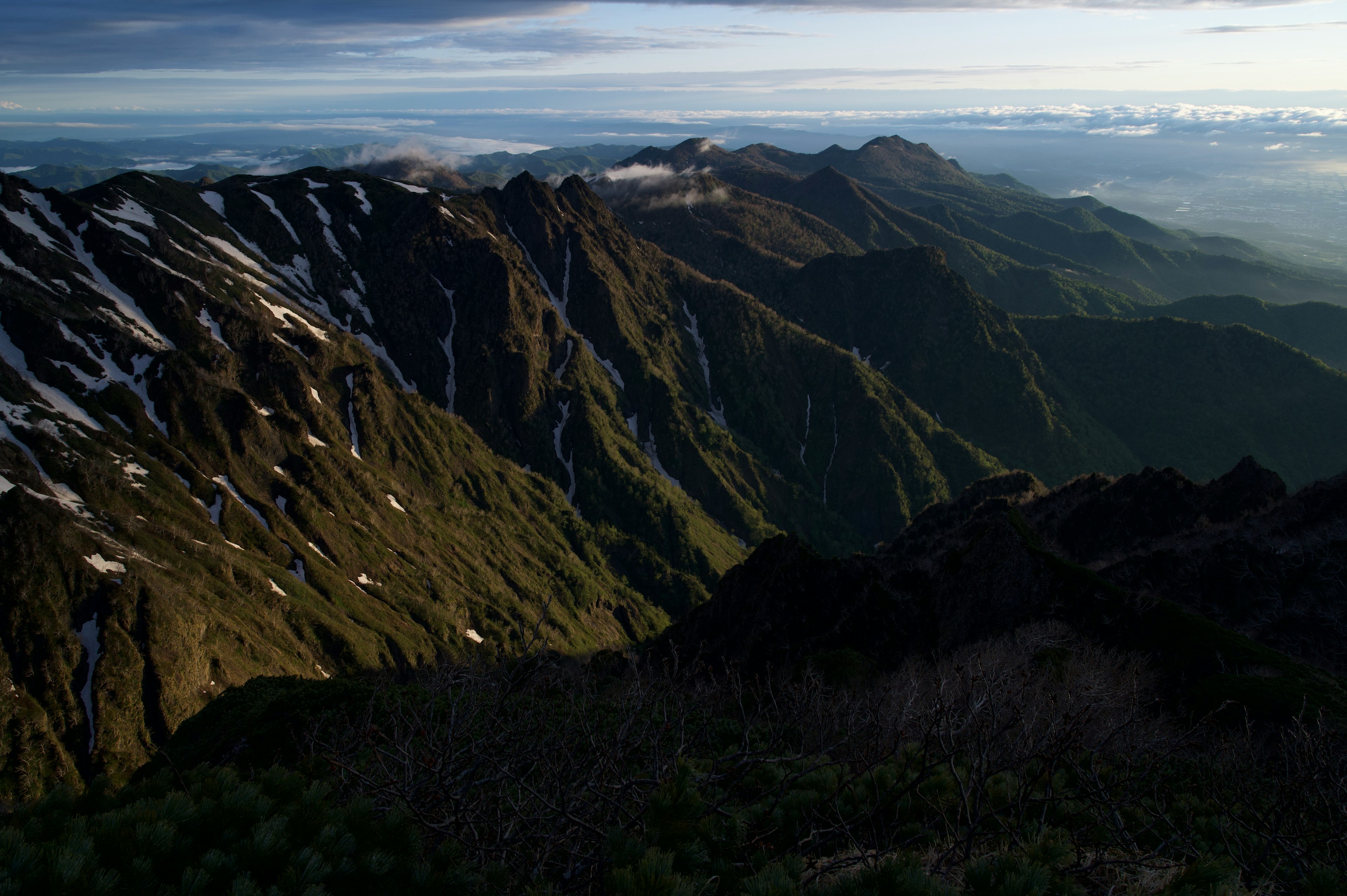 Breathtaking mountain landscape with snow-capped peaks and lush valleys