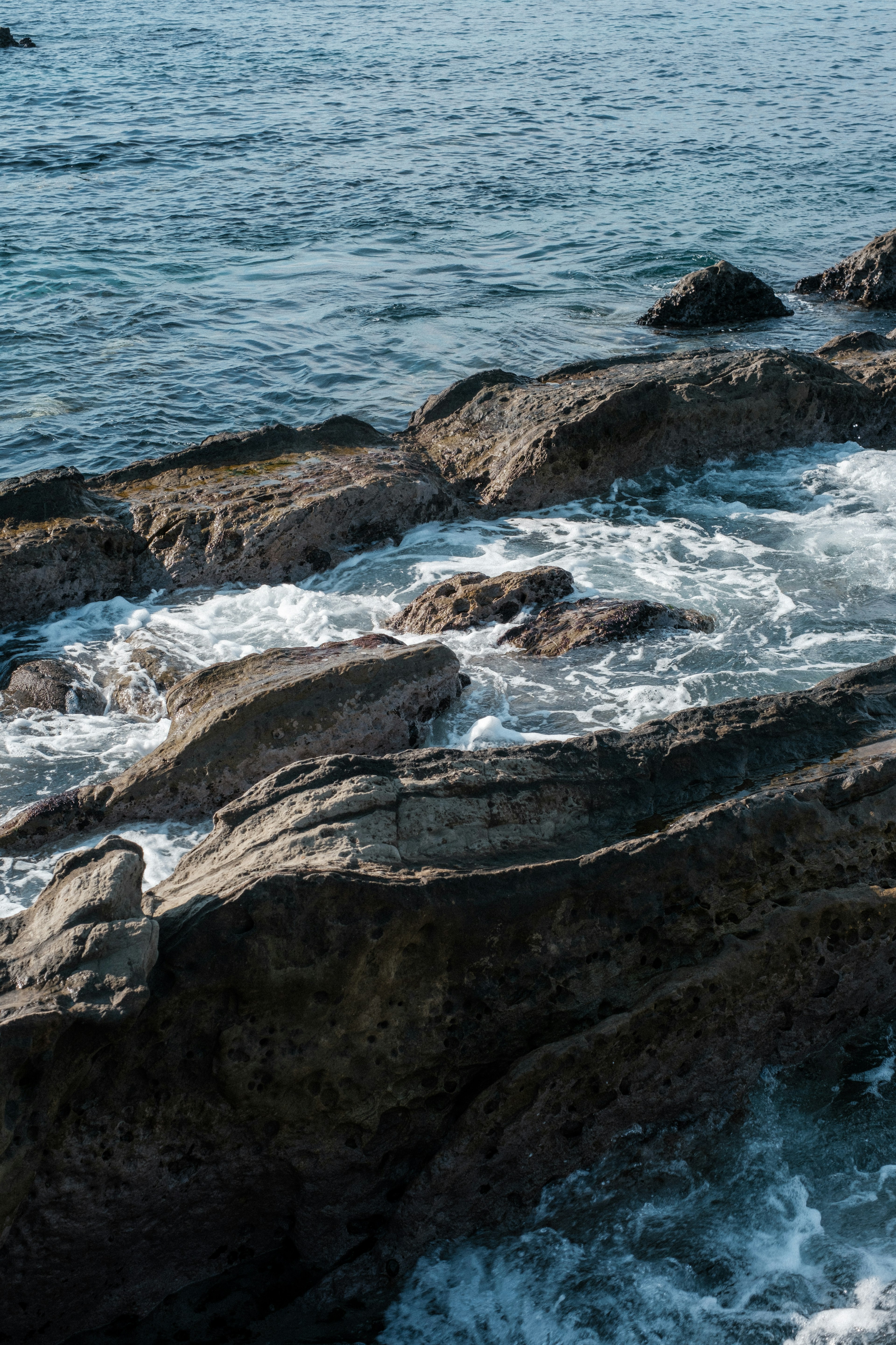 Waves crashing against rocky shoreline