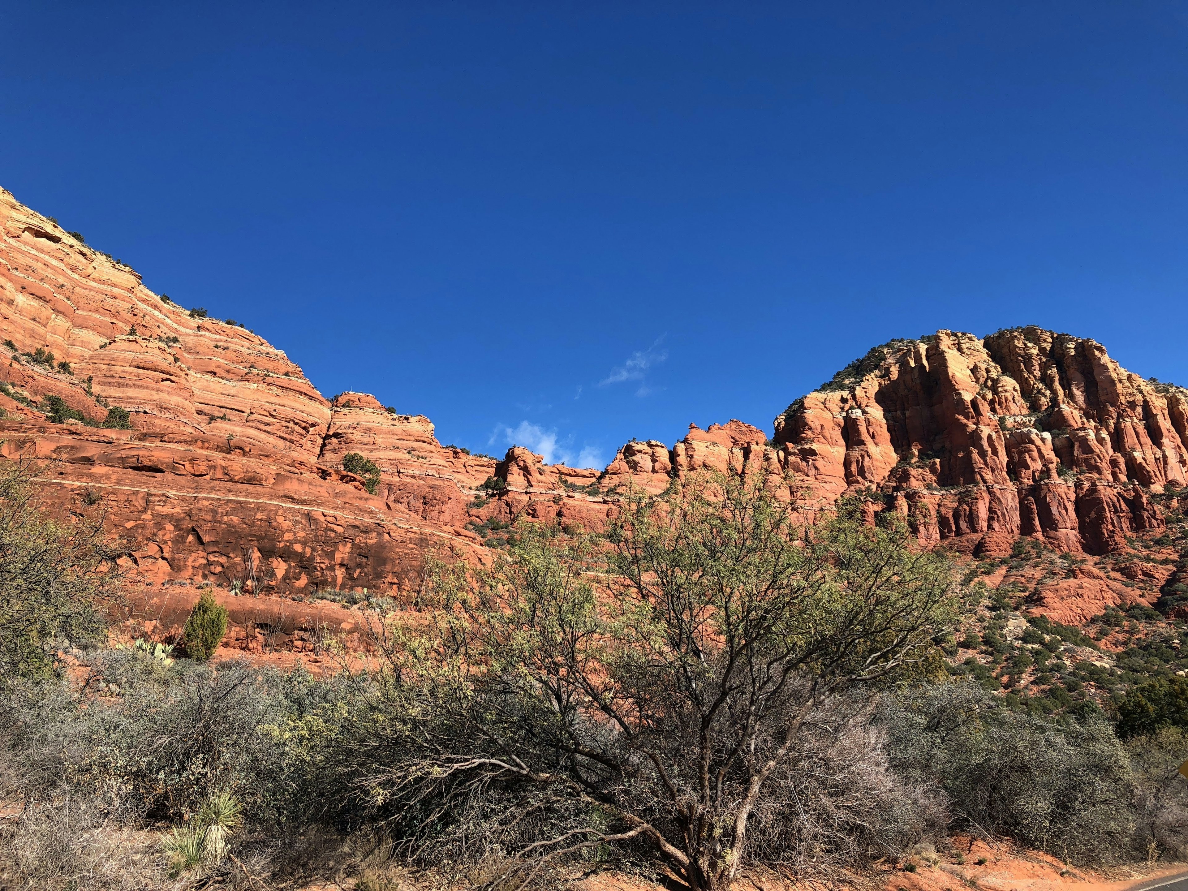 Scenic view of red rock formations under a blue sky