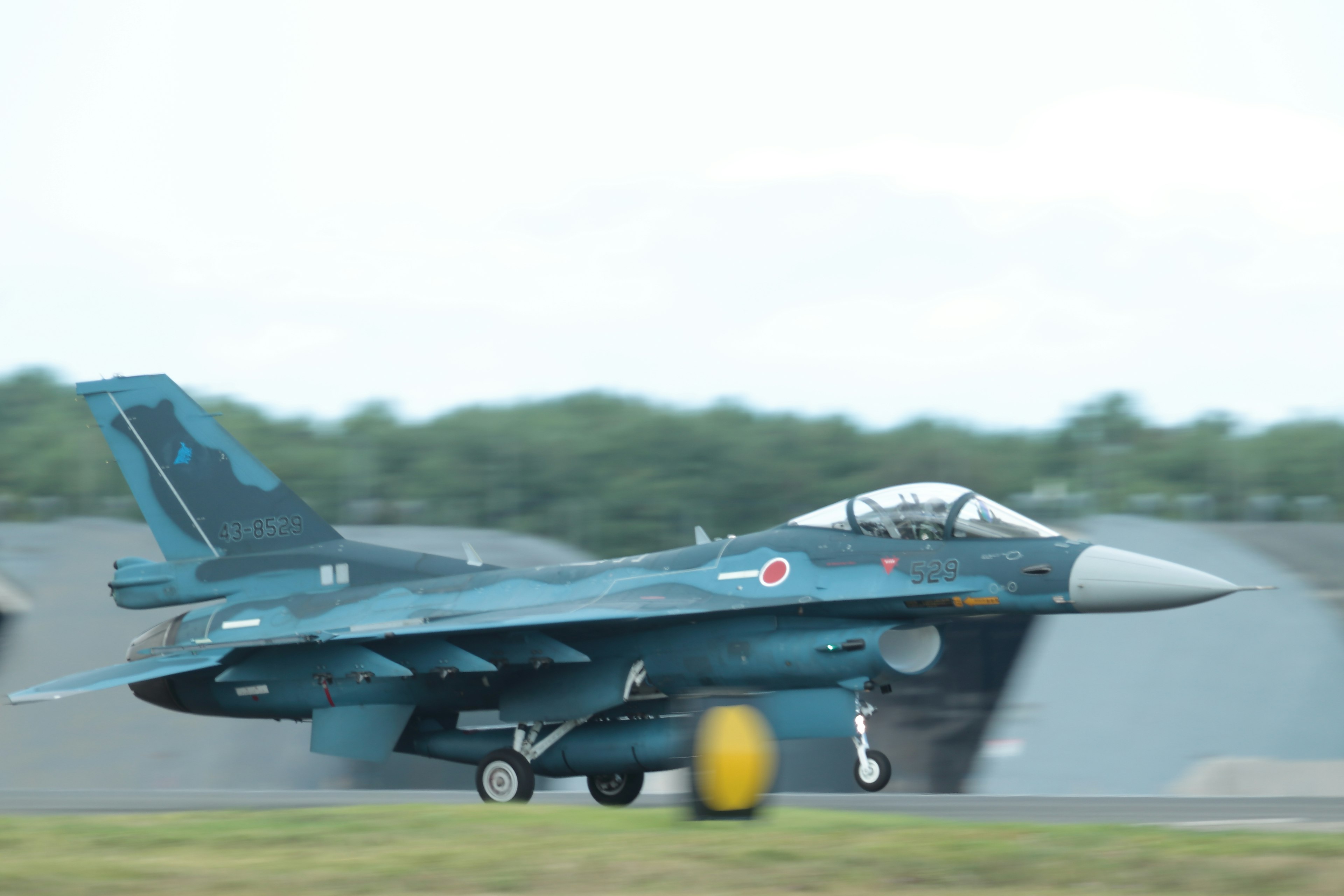 Japanese fighter jet taxiing on the runway