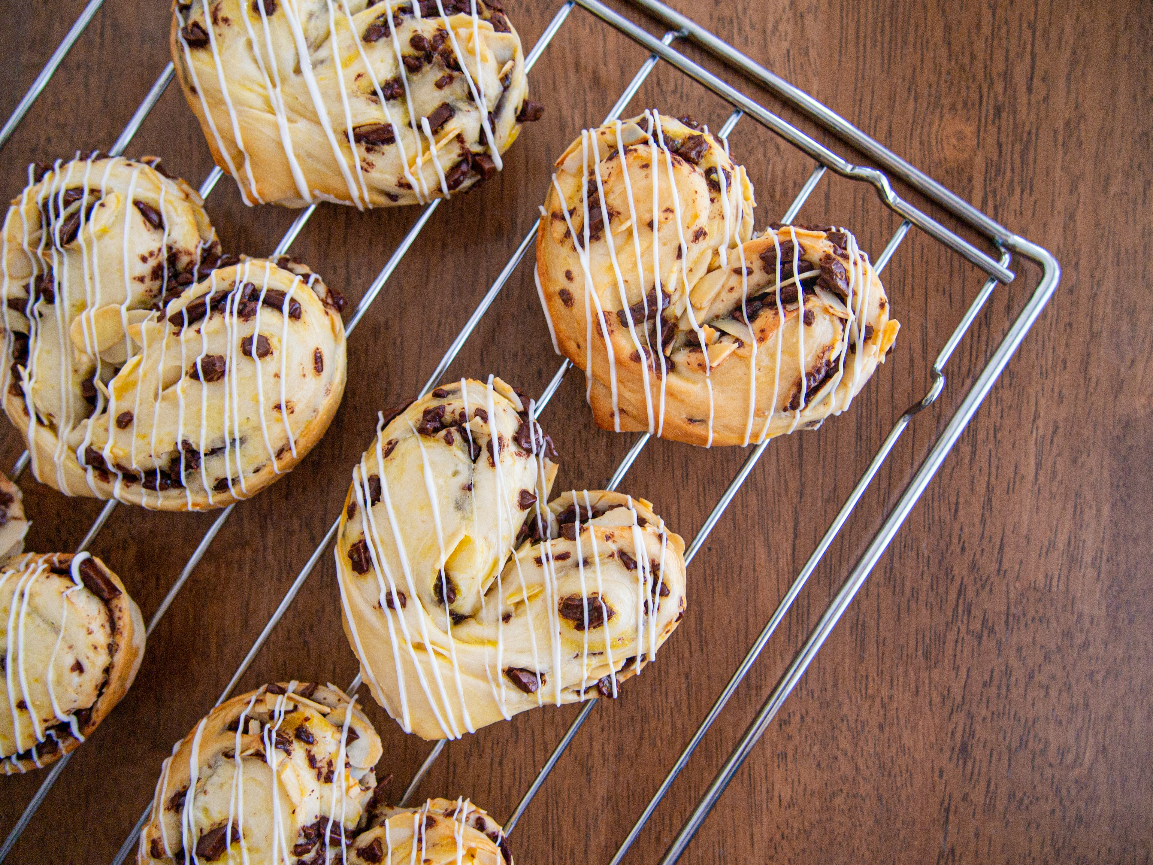 Heart-shaped chocolate pastries on a wire rack