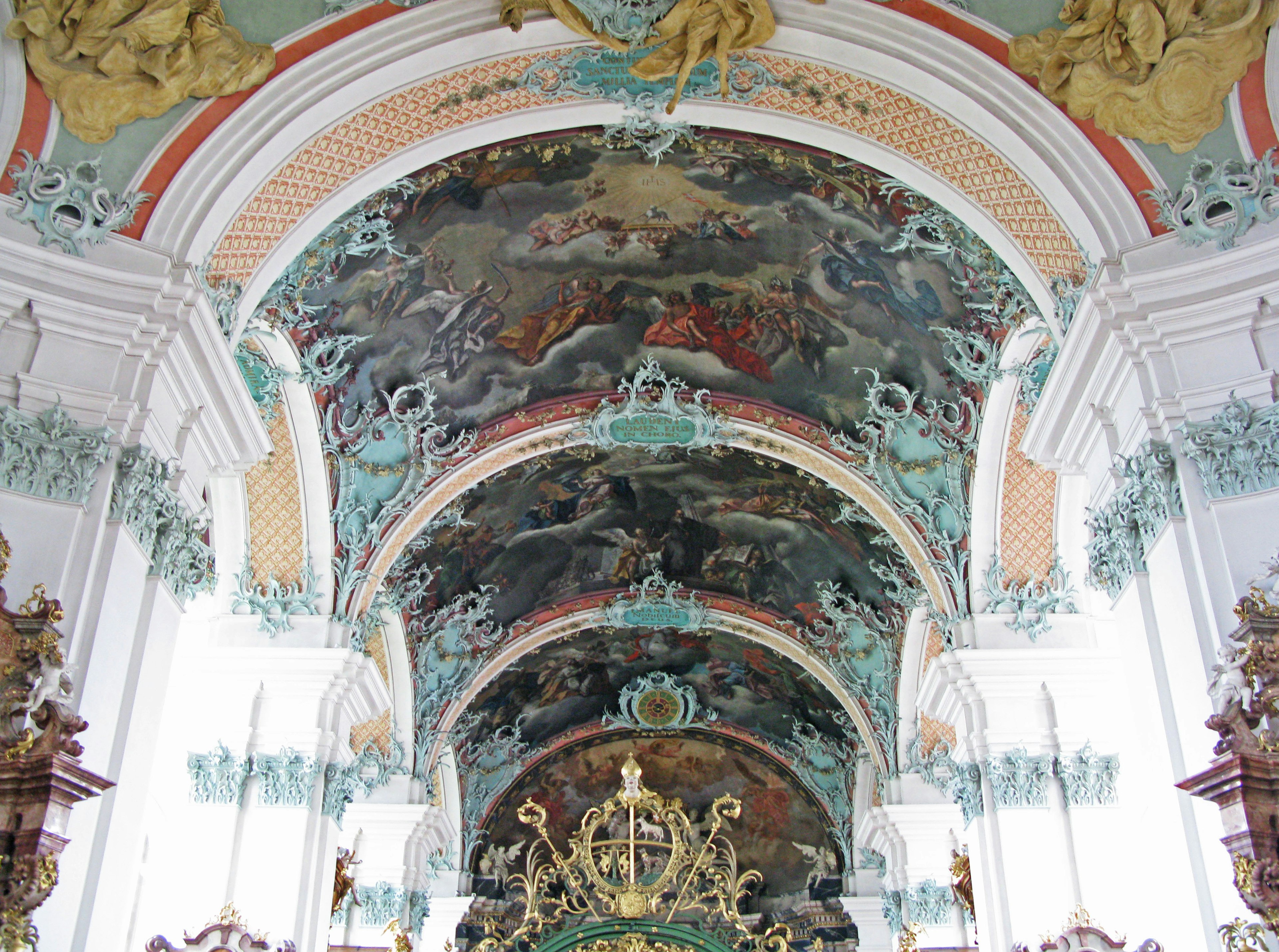 Photo of a beautifully decorated church ceiling featuring vibrant colors and intricate paintings