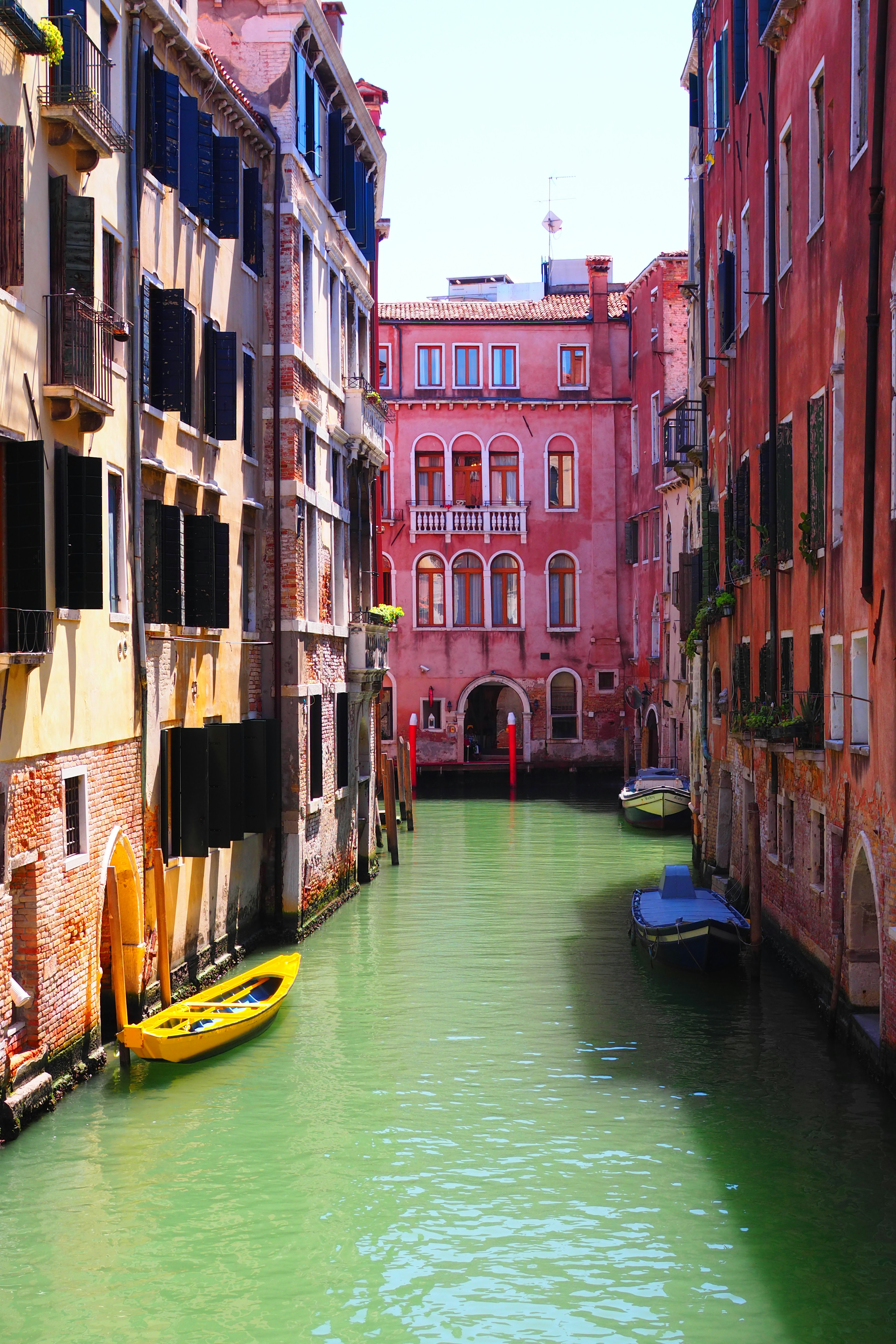 Colorful buildings and boats along a canal in Venice