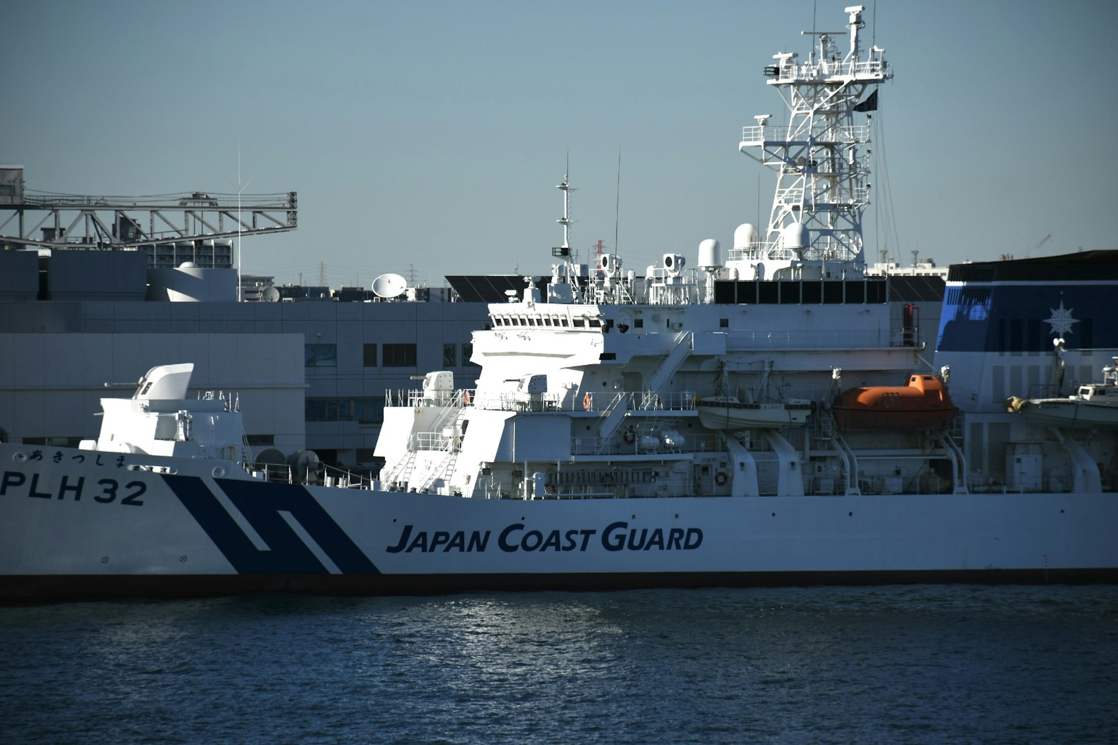 A Japan Coast Guard vessel docked at the harbor