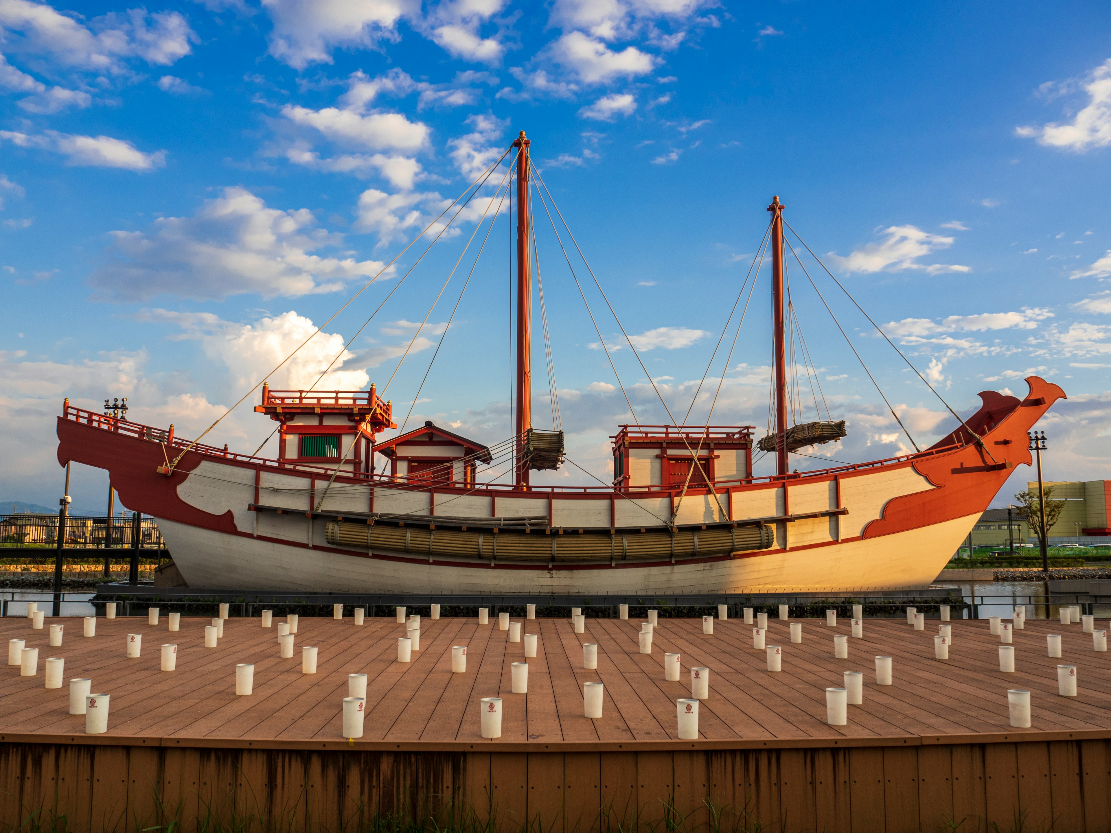 Traditional boat docked under a beautiful blue sky