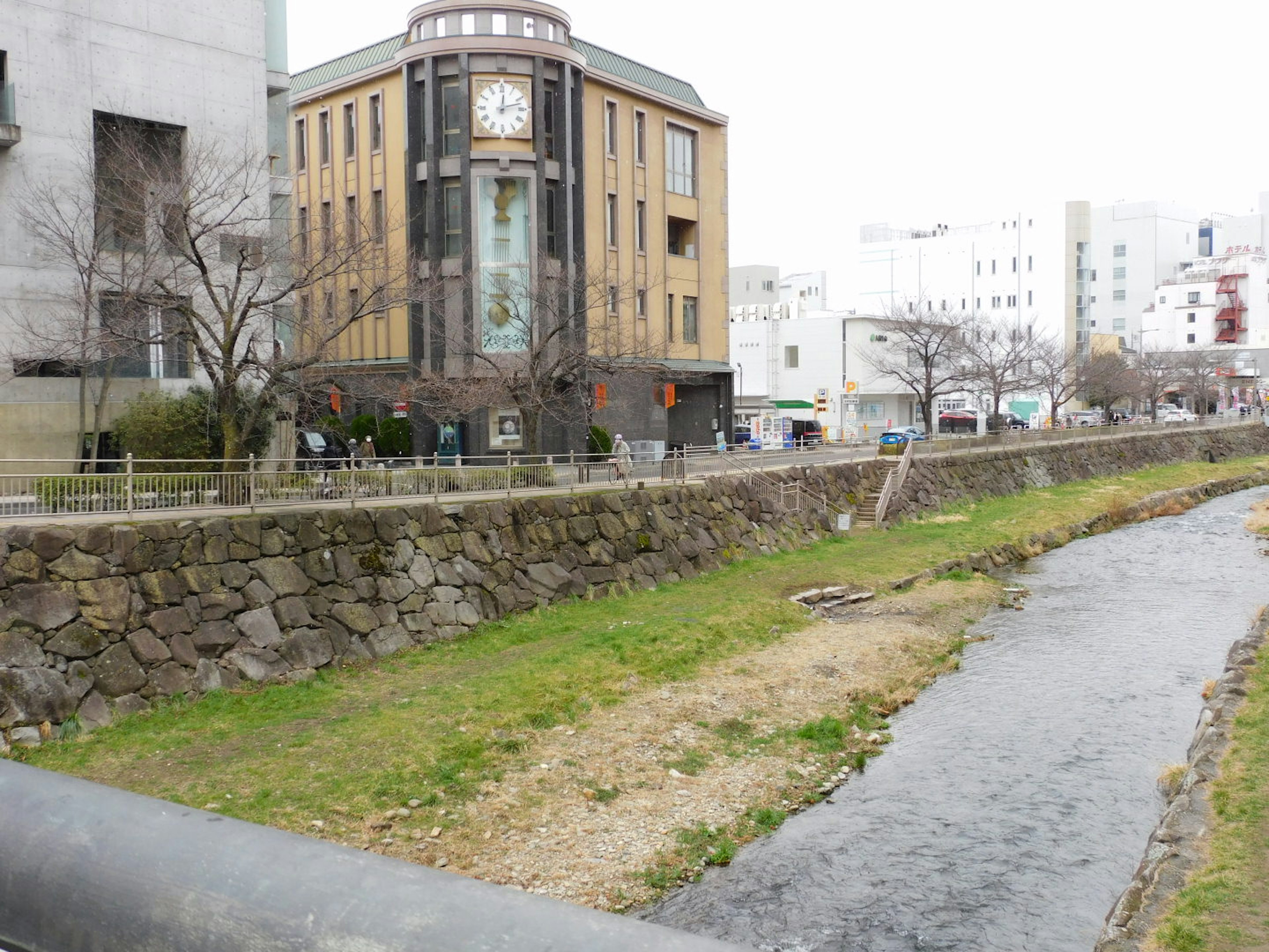 Scenic view of a river alongside an old building