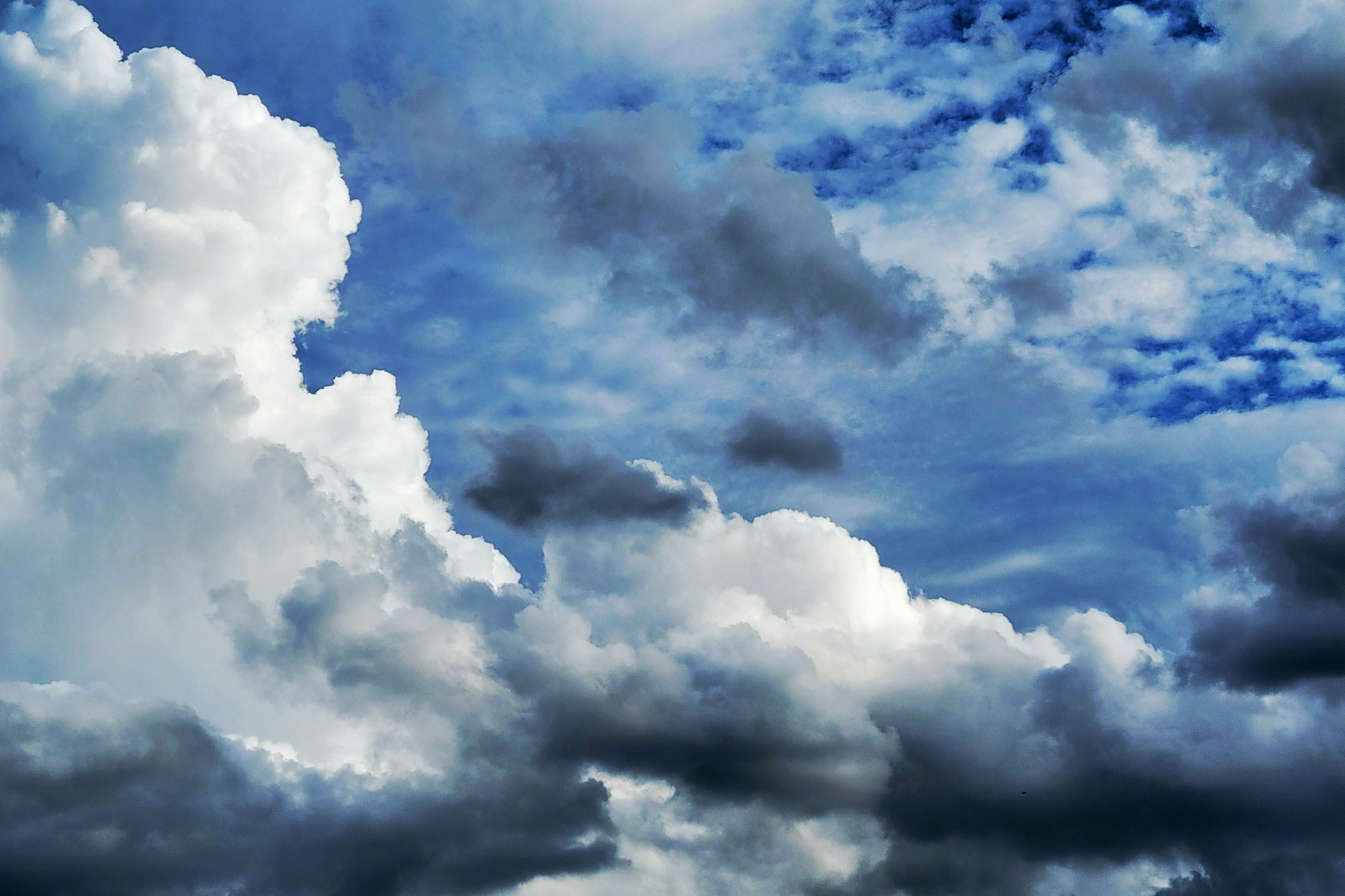 Vibrant blue sky with fluffy white clouds