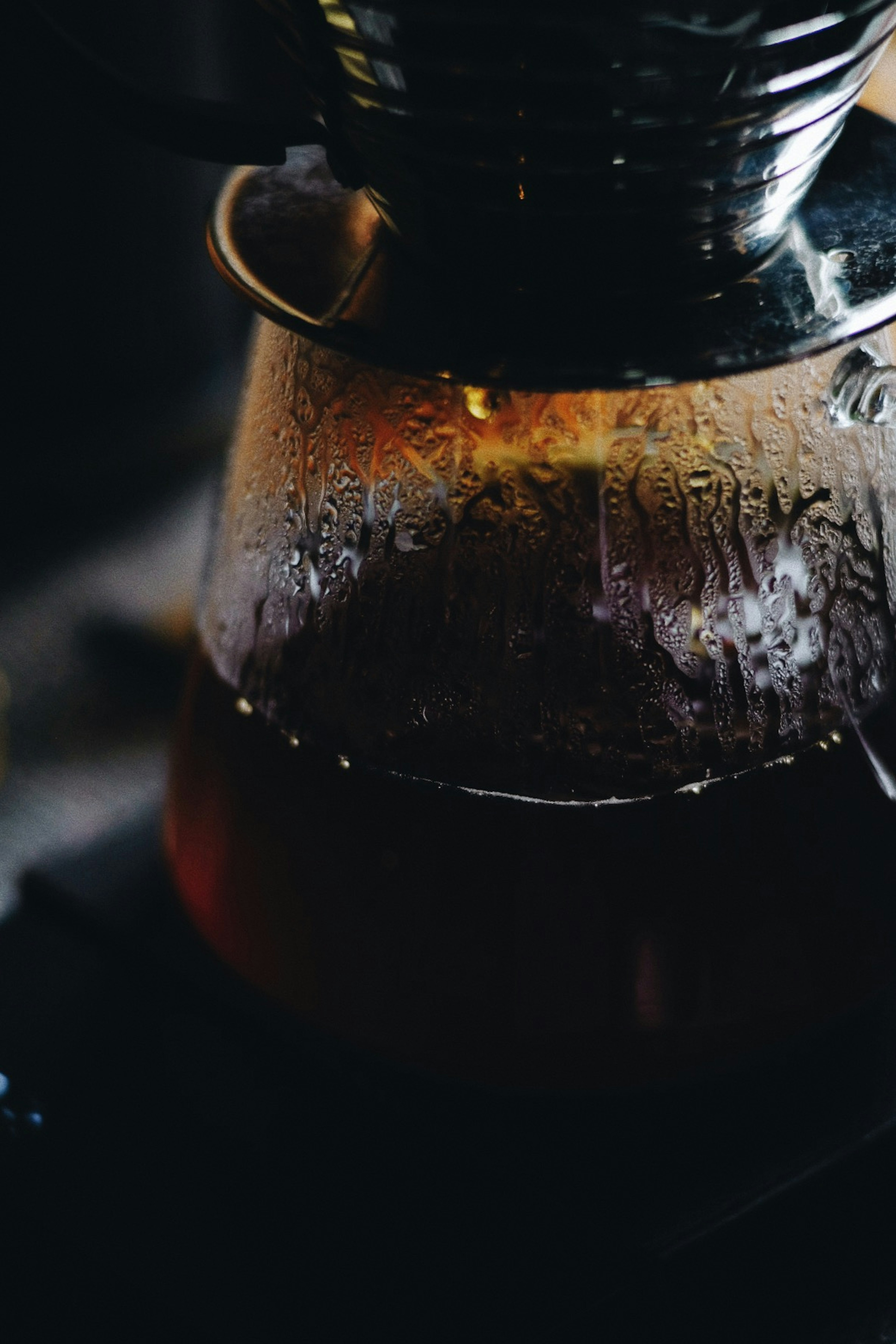 Close-up of a coffee pot with steam rising