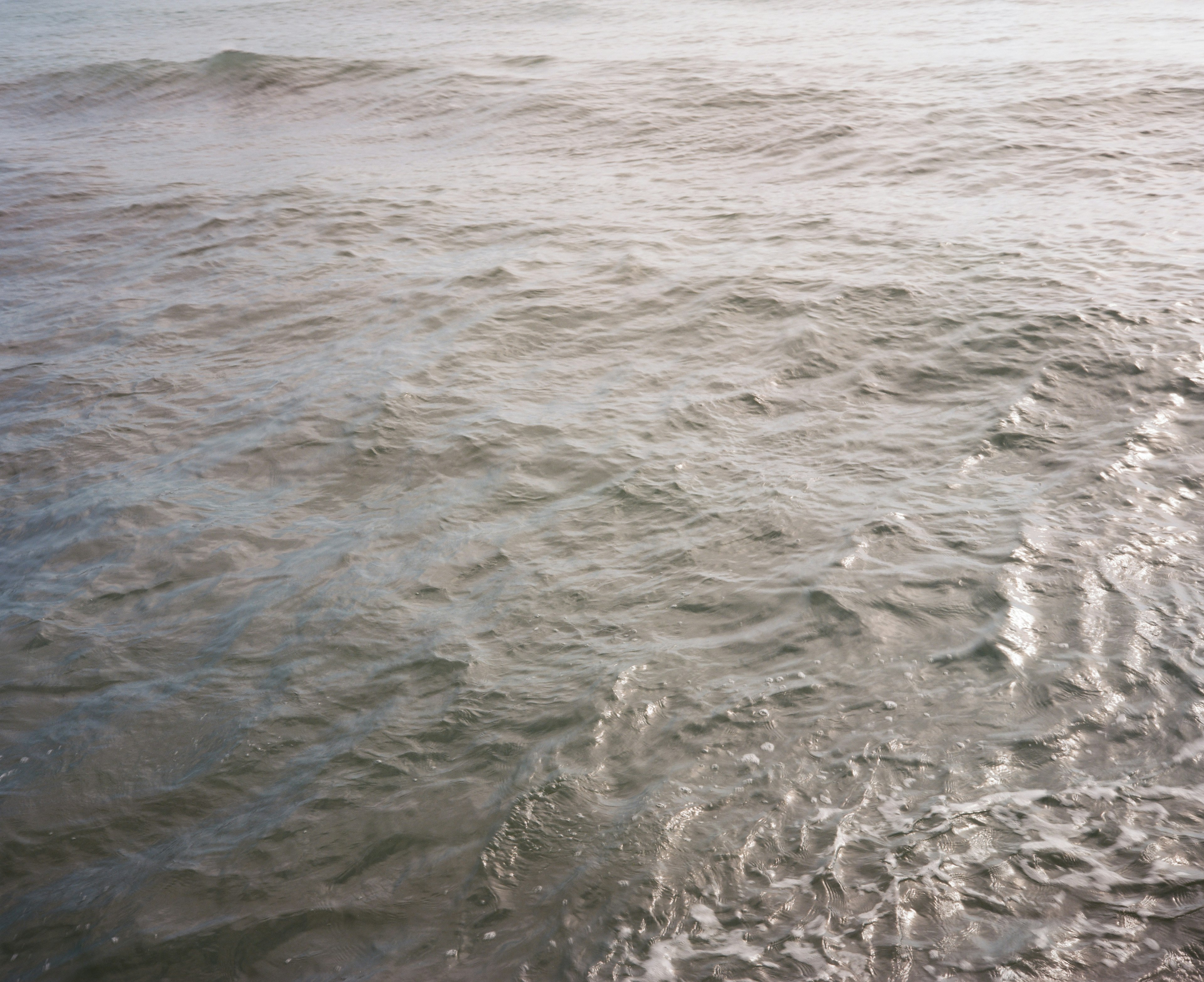 Textured surface of a calm ocean with gentle waves