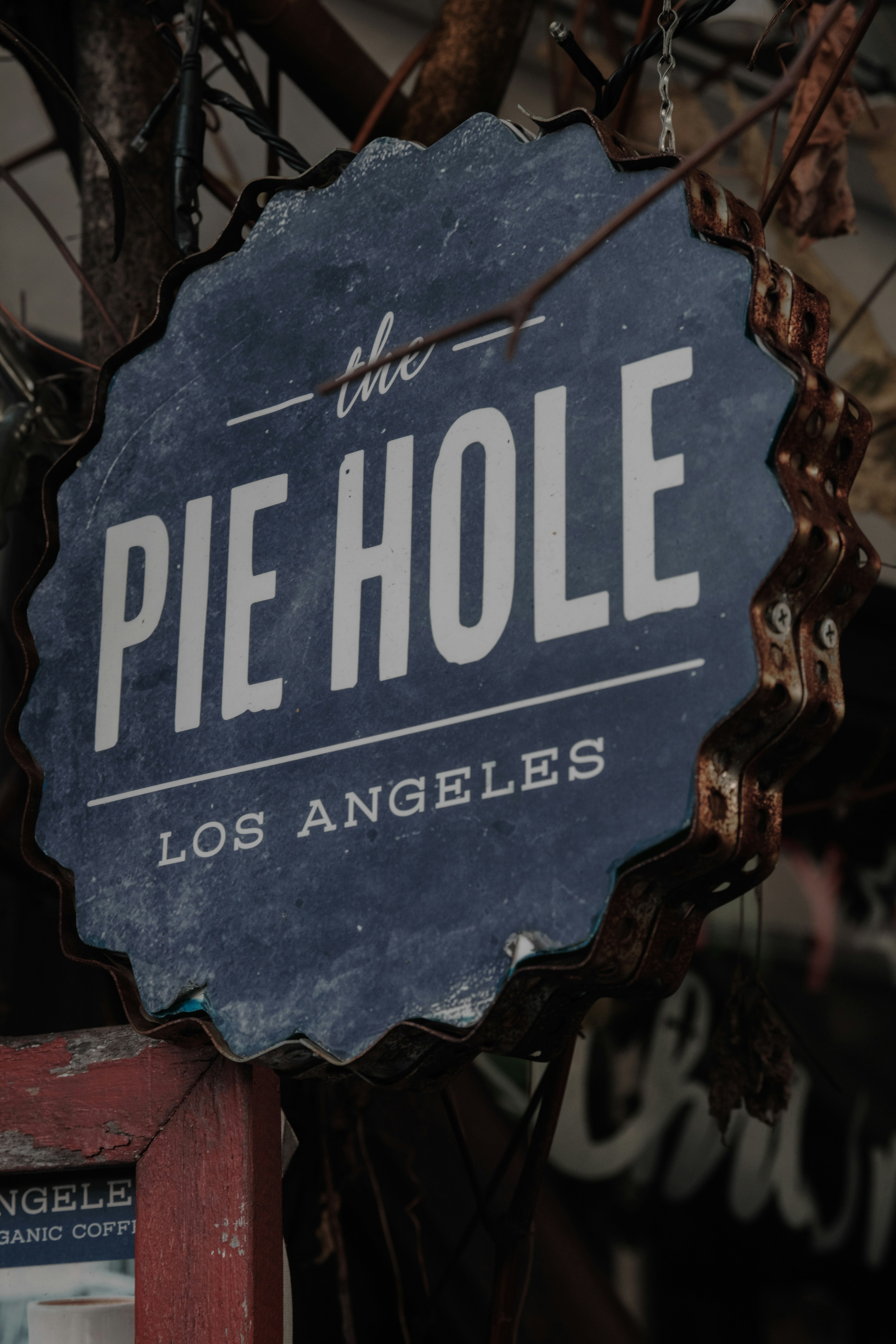 Sign of The Pie Hole in Los Angeles featuring a blue background and white lettering