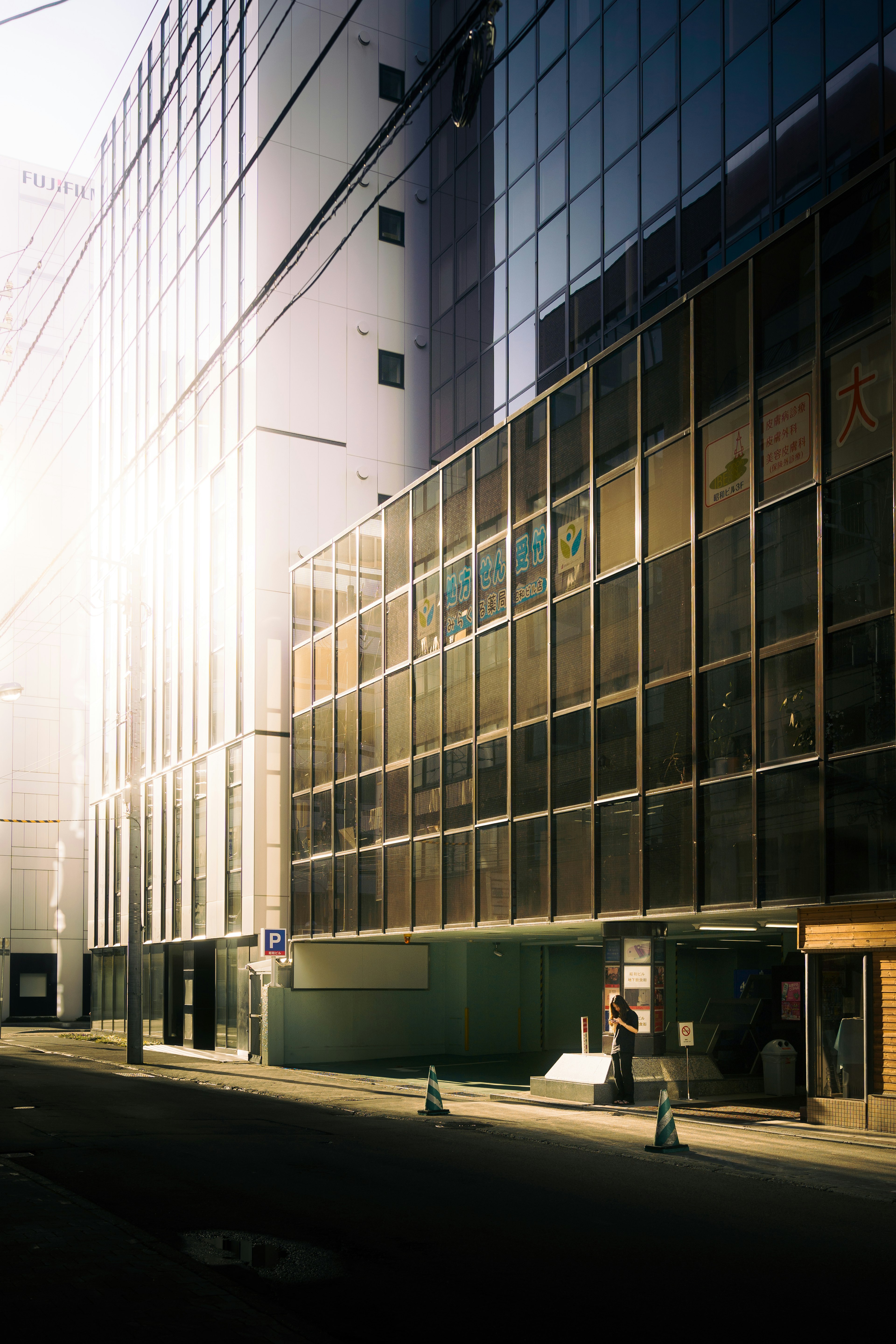 Image capturing the exterior of a glass building among modern skyscrapers