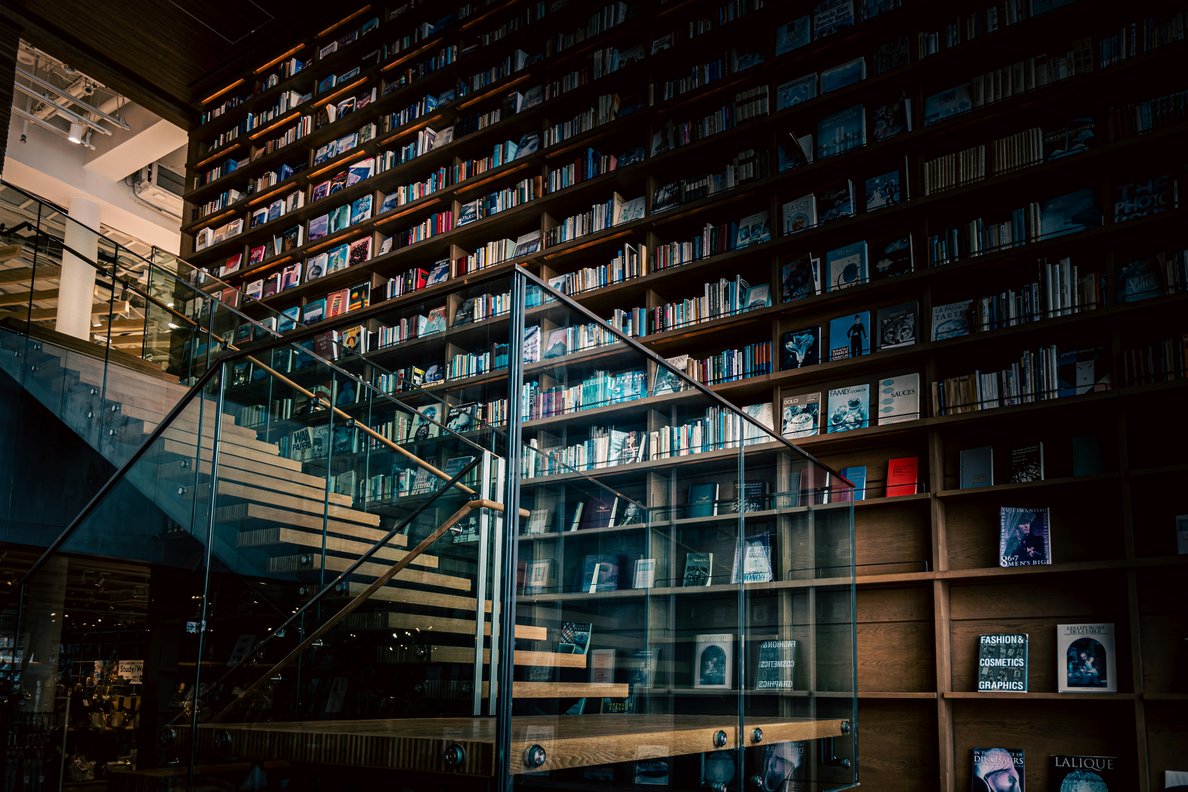 Modern library interior with staircase and bookshelves